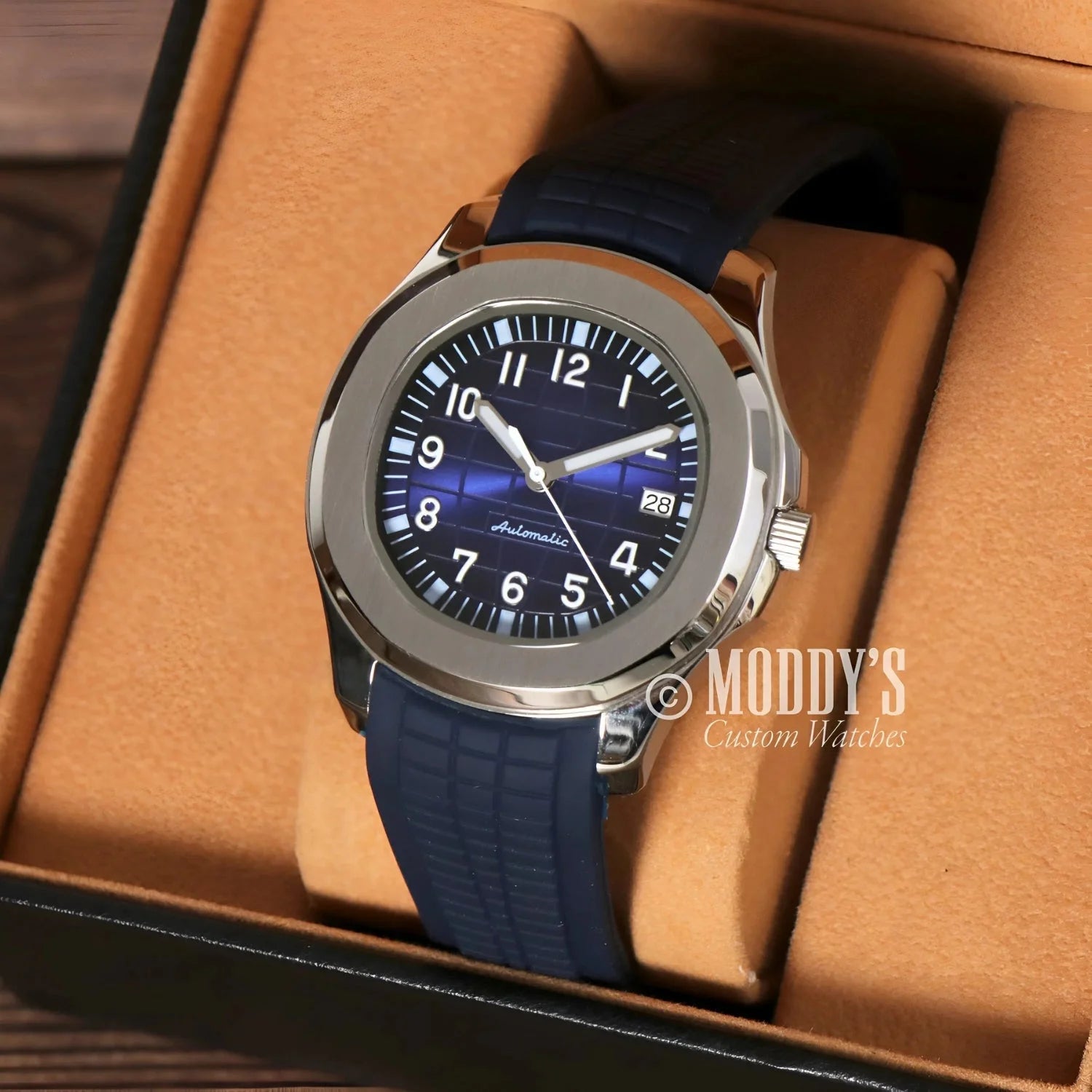 Silver wristwatch with blue band featuring Seiko NH35 automatic movement in Seikonaut design