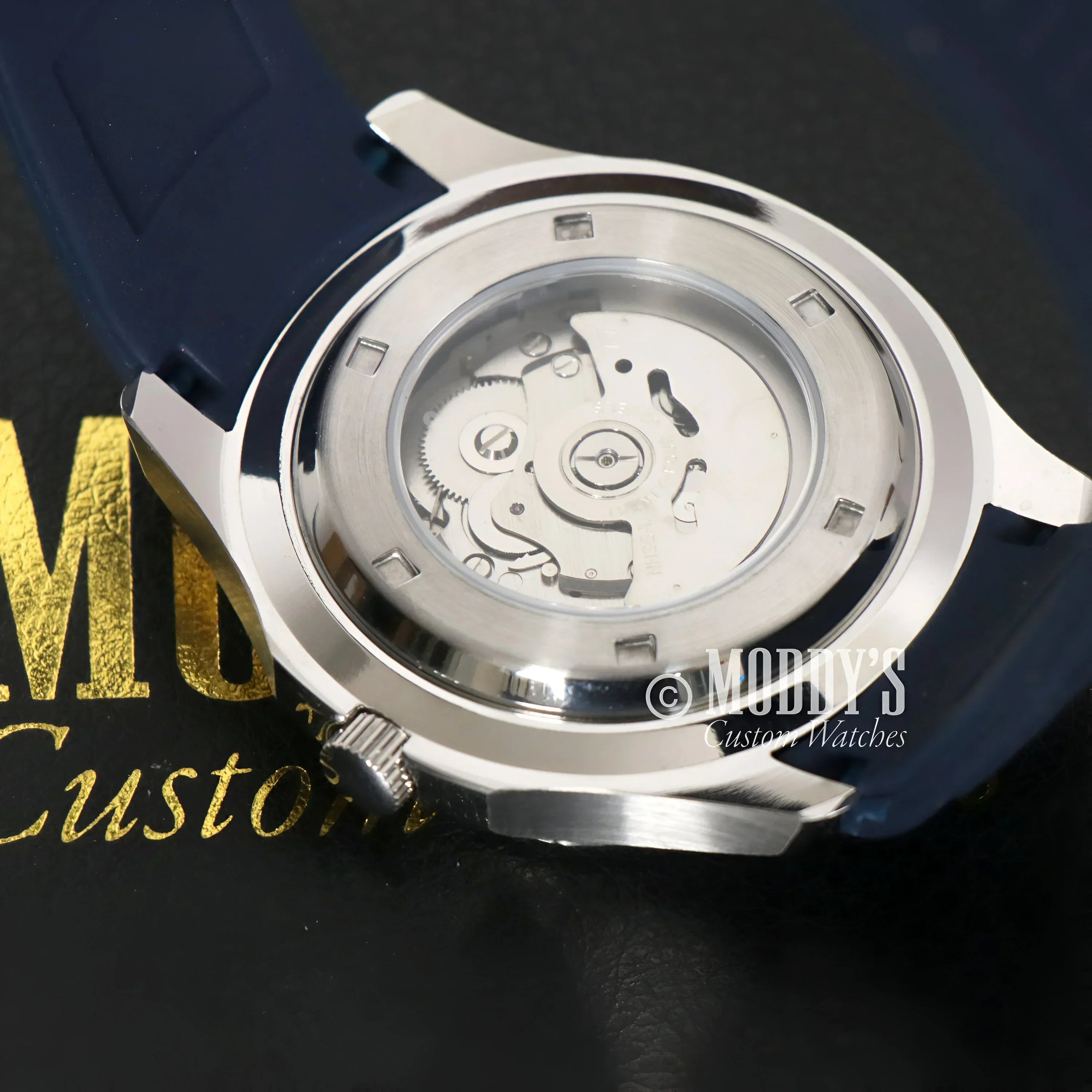 Silver Seikonaut Blue watch showcasing NH35 automatic movement and visible mechanism