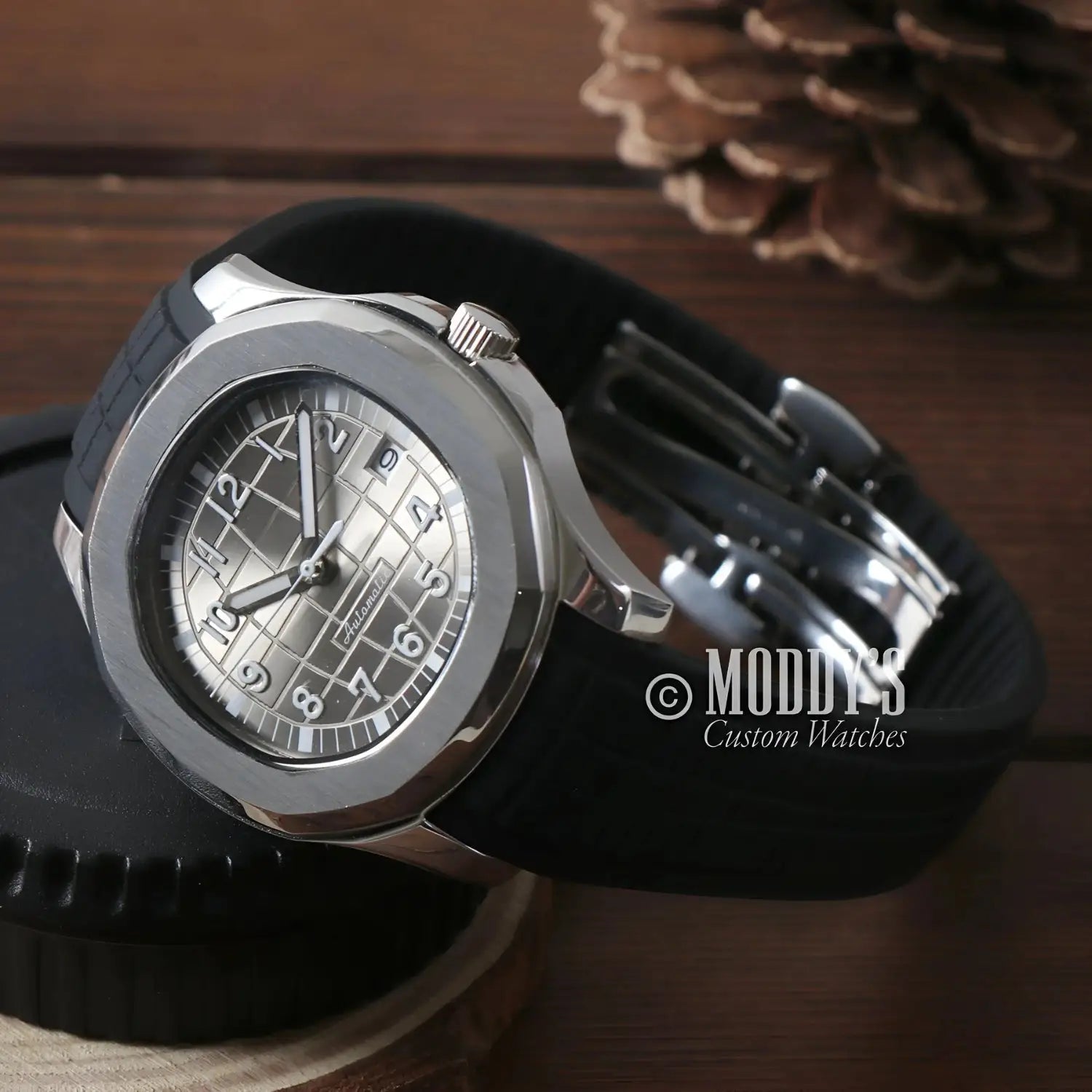 Silver Seikonaut wristwatch with black band and Seiko NH35 automatic movement