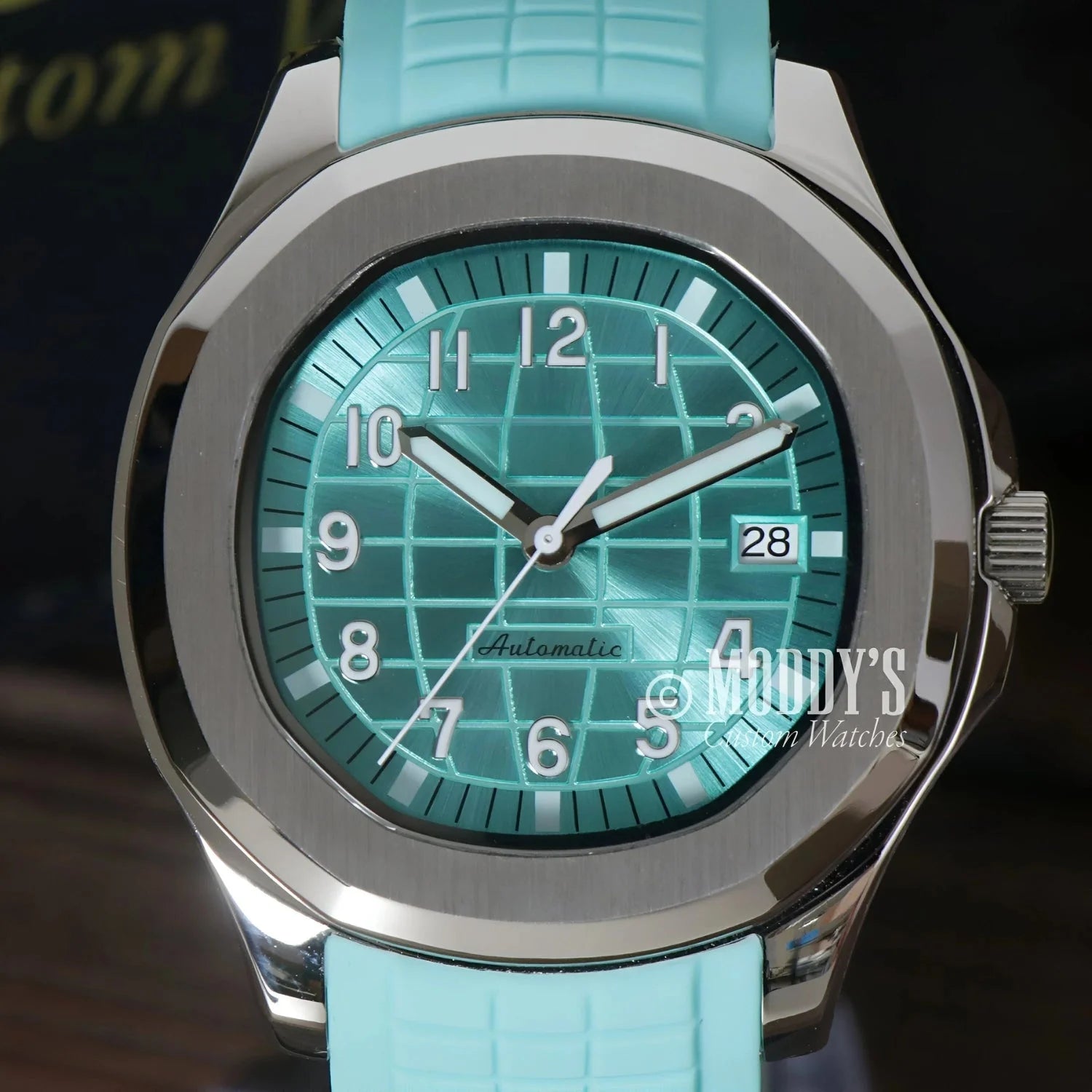 Aqua-faced Seiko Mod Aquanaut wristwatch with silver casing and Tiffany Metallic Blue design