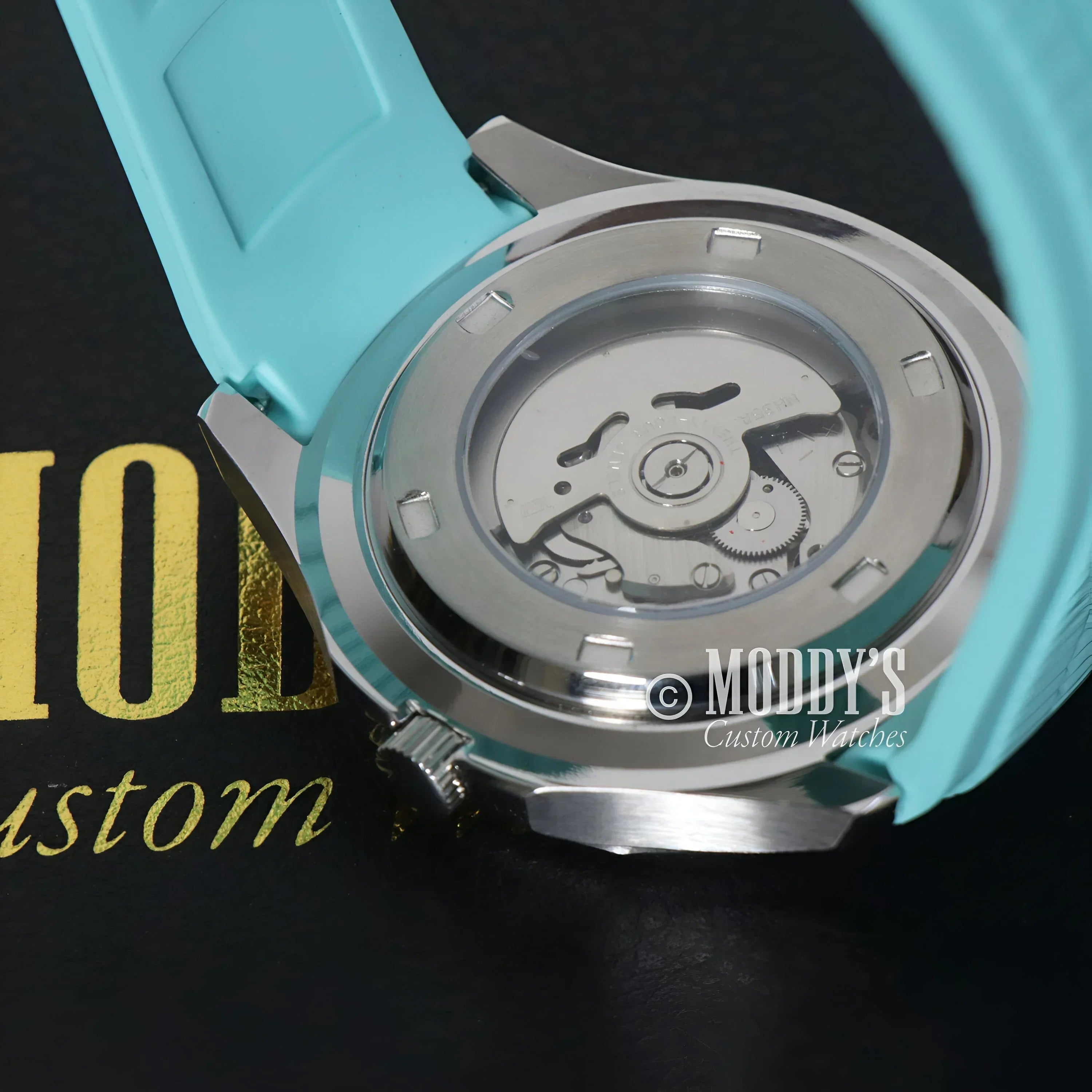 Turquoise Seikonaut watch showcasing seiko nh35 automatic movement in Tiffany Metallic Blue