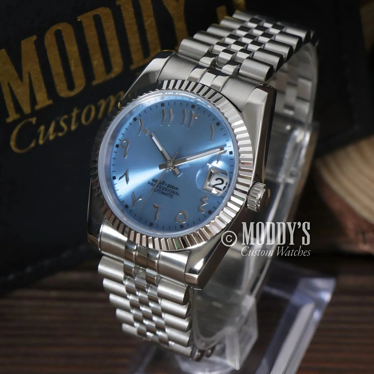Silver Seikojust Ice Blue Arabic wristwatch featuring Arabic numerals and NH35 automatic