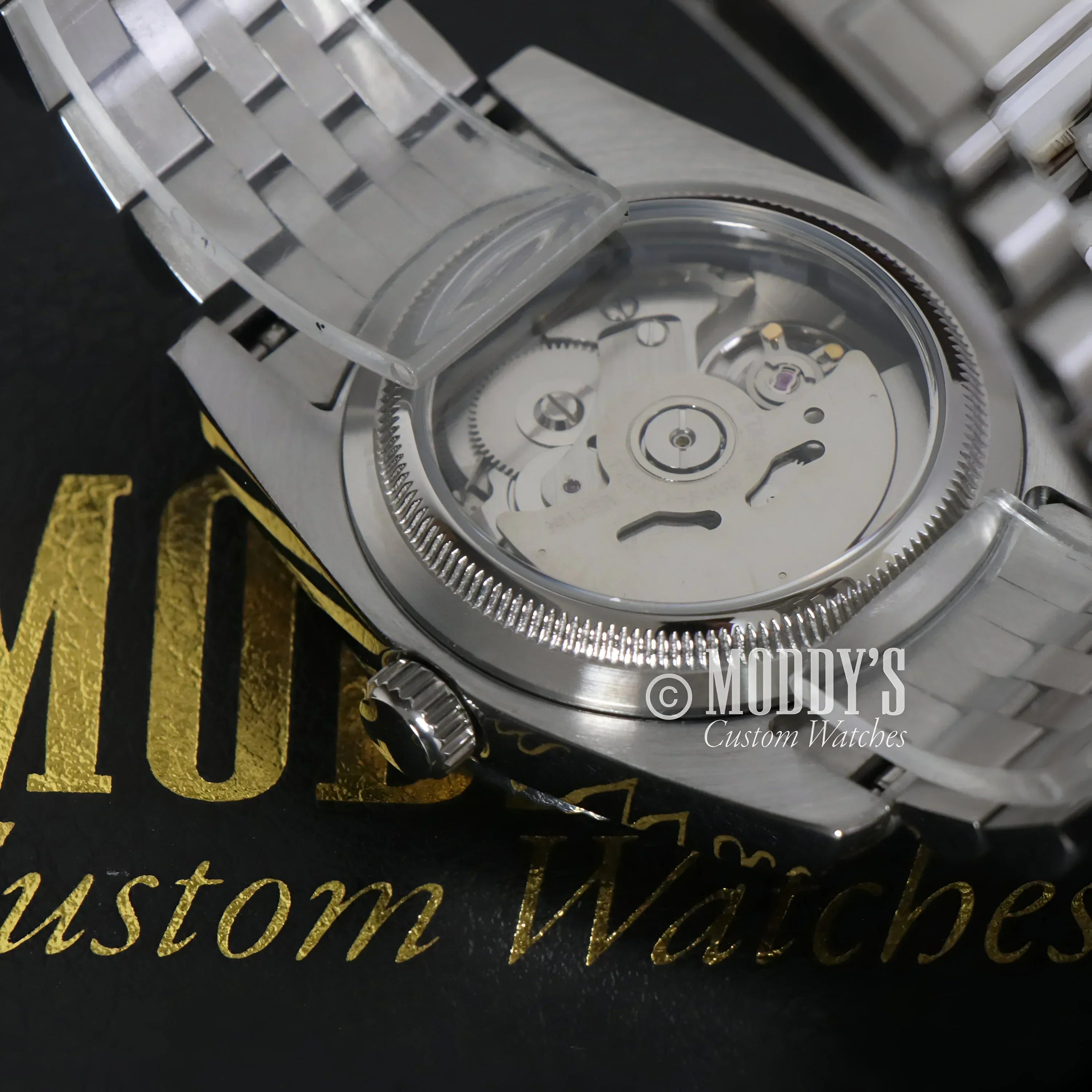 Silver wristwatch with exposed movement from Seikojust Ice Blue Arabic, Seiko NH35 Automatic