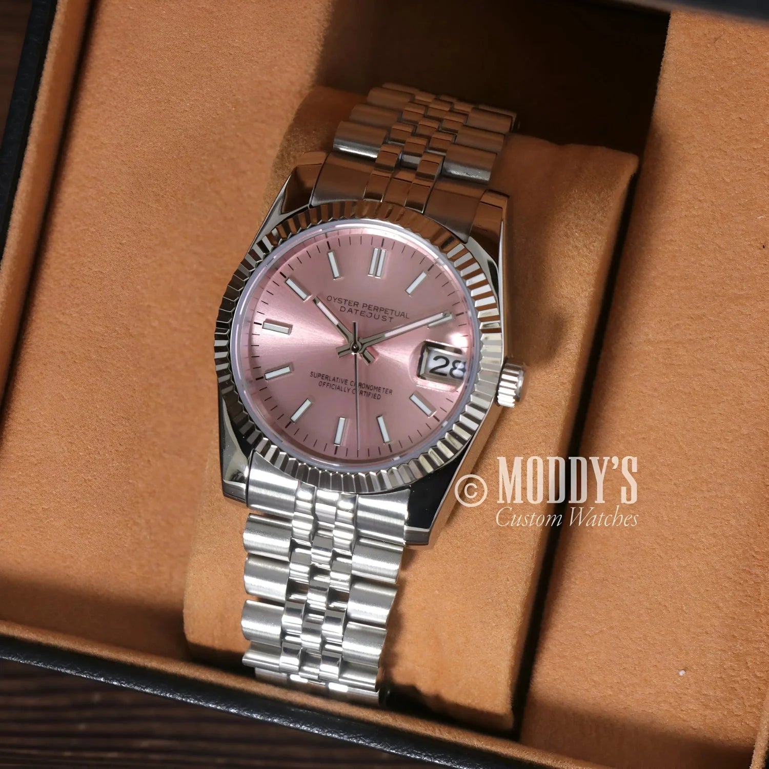Silver Seikojust wristwatch with pink face, featuring Seiko NH35 Automatic movement