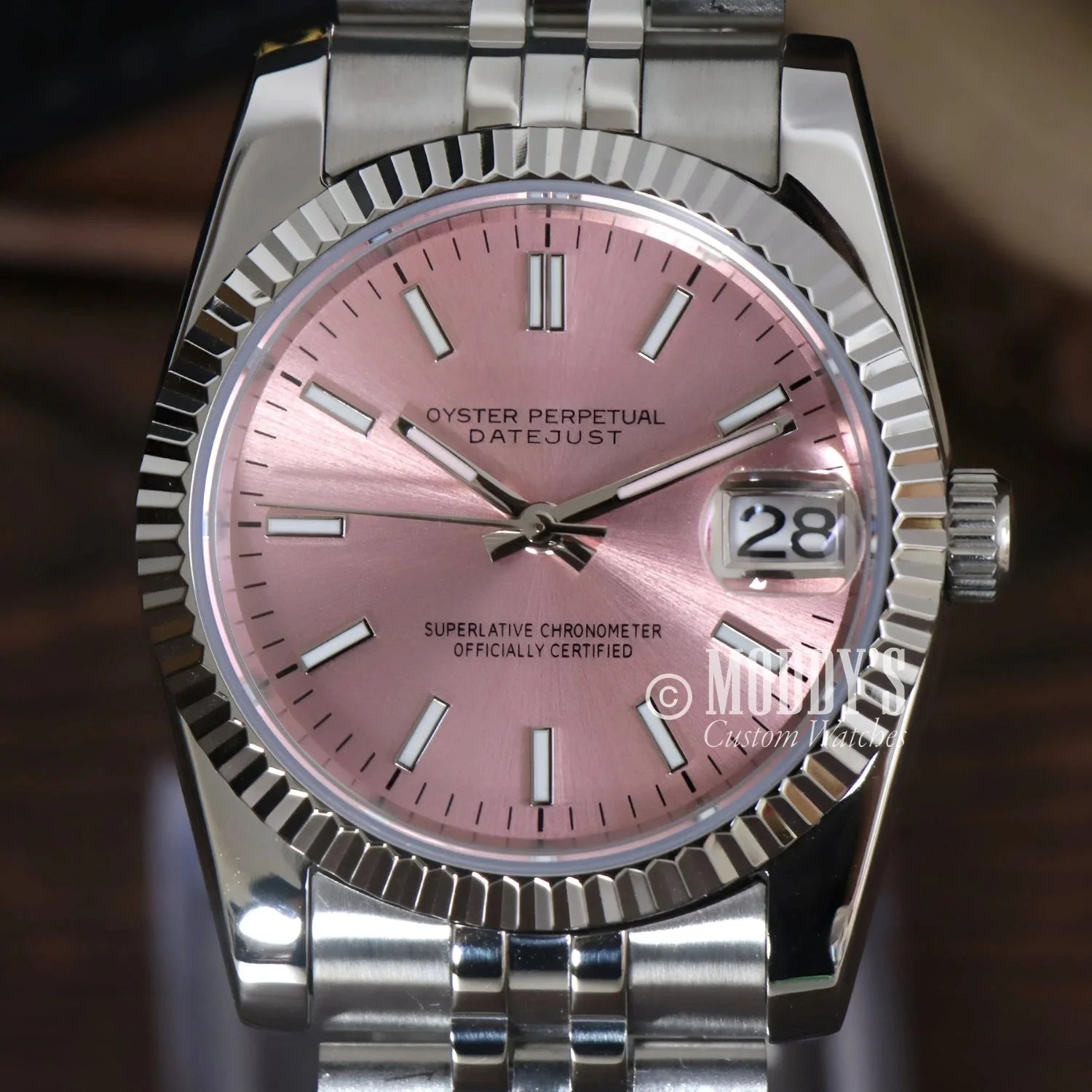 Silver Rolex Datejust watch with a pink face in Seikojust mod featuring Seiko NH35 automatic