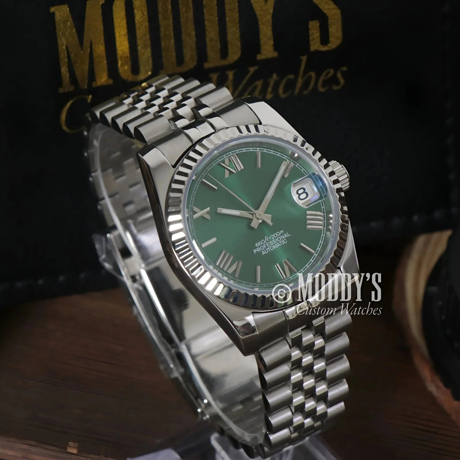 Silver Seikojust wristwatch with green face and NH35 automatic movement