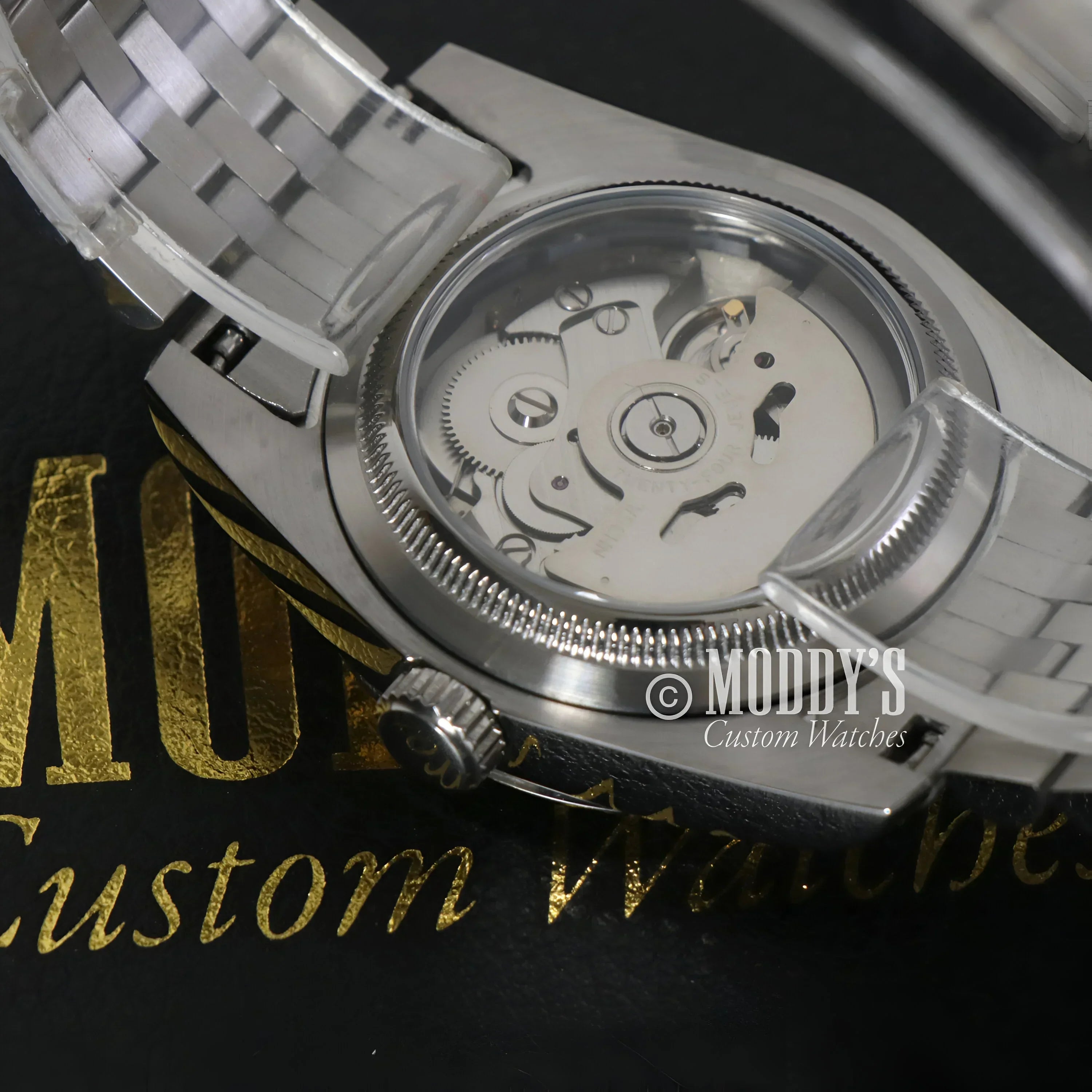 Silver wristwatch with exposed movement from Seikojust Roman Silver, featuring Seiko NH35 automatic