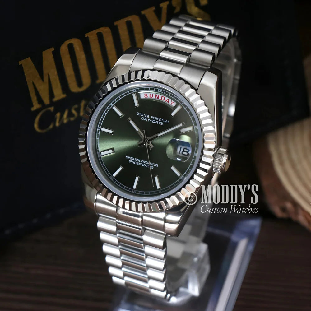 Silver wristwatch featuring a green face from Seikojust Daydate Mint Green collection