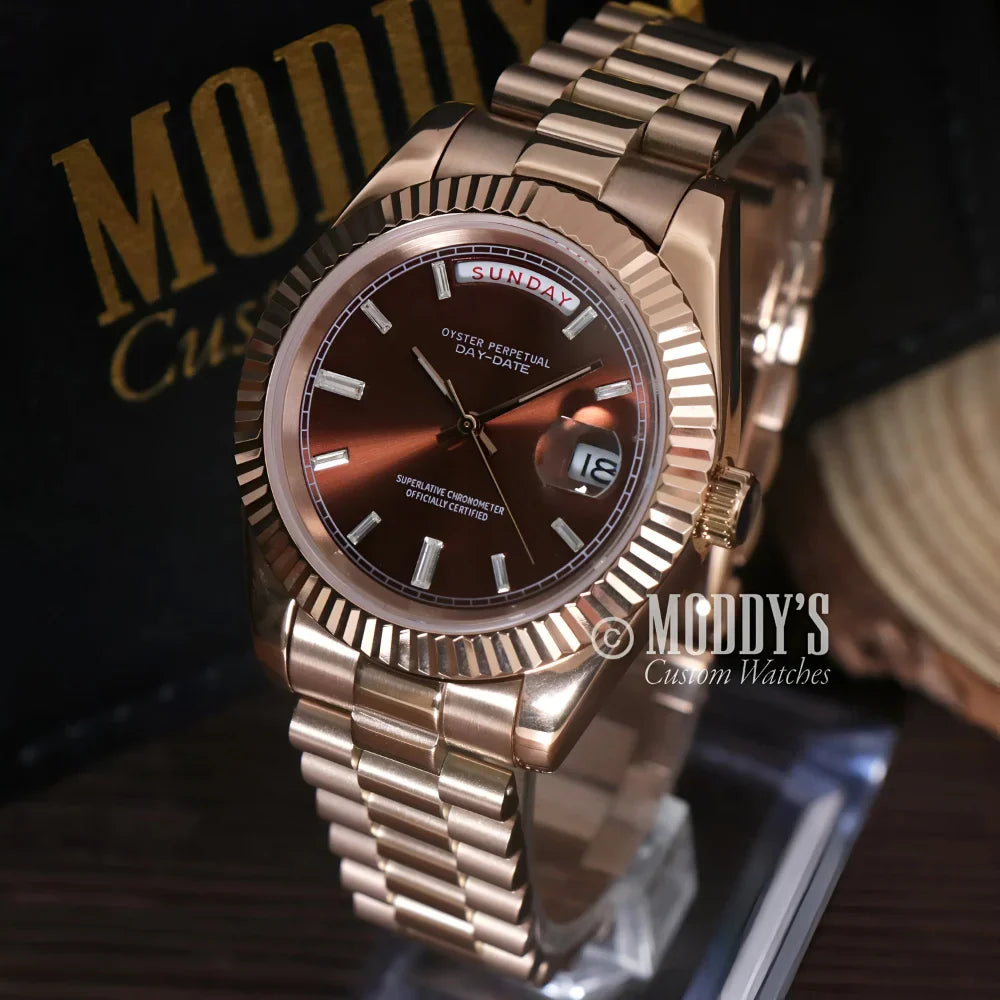 Rose gold wristwatch from Seikojust featuring daydate function with chocolate crystals