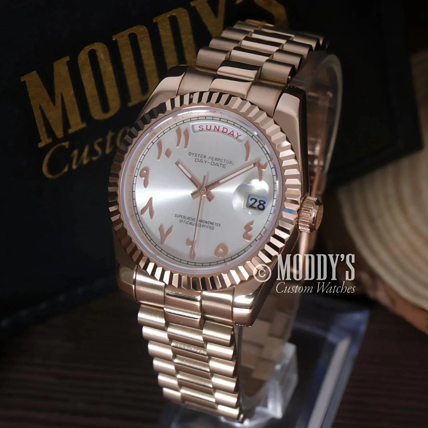 Rose gold wristwatch with Arabic numerals from Seikojust Daydate Rose Gold collection