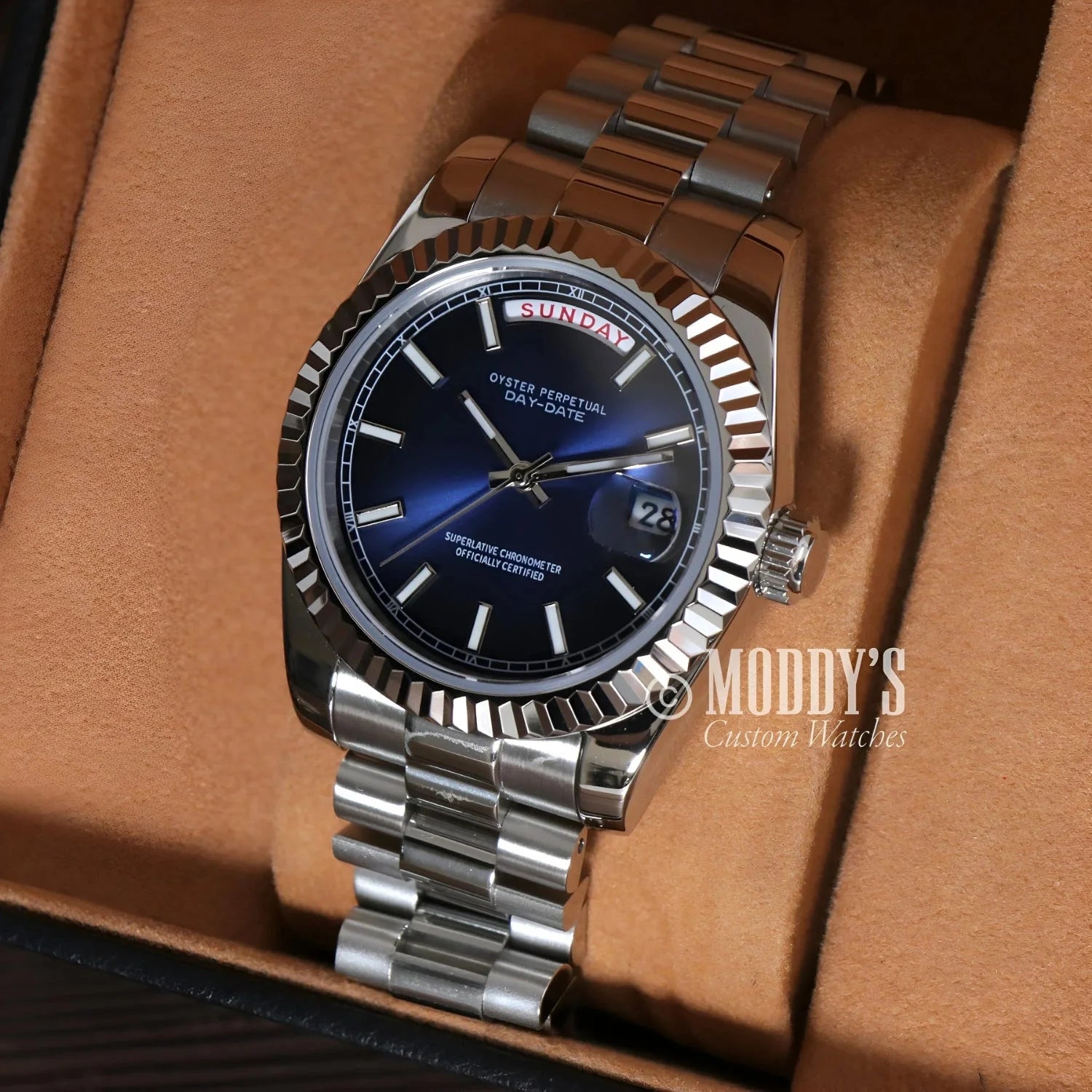 Silver wristwatch with blue face, Seiko Mod Daydate Royal Blue in 904L stainless steel