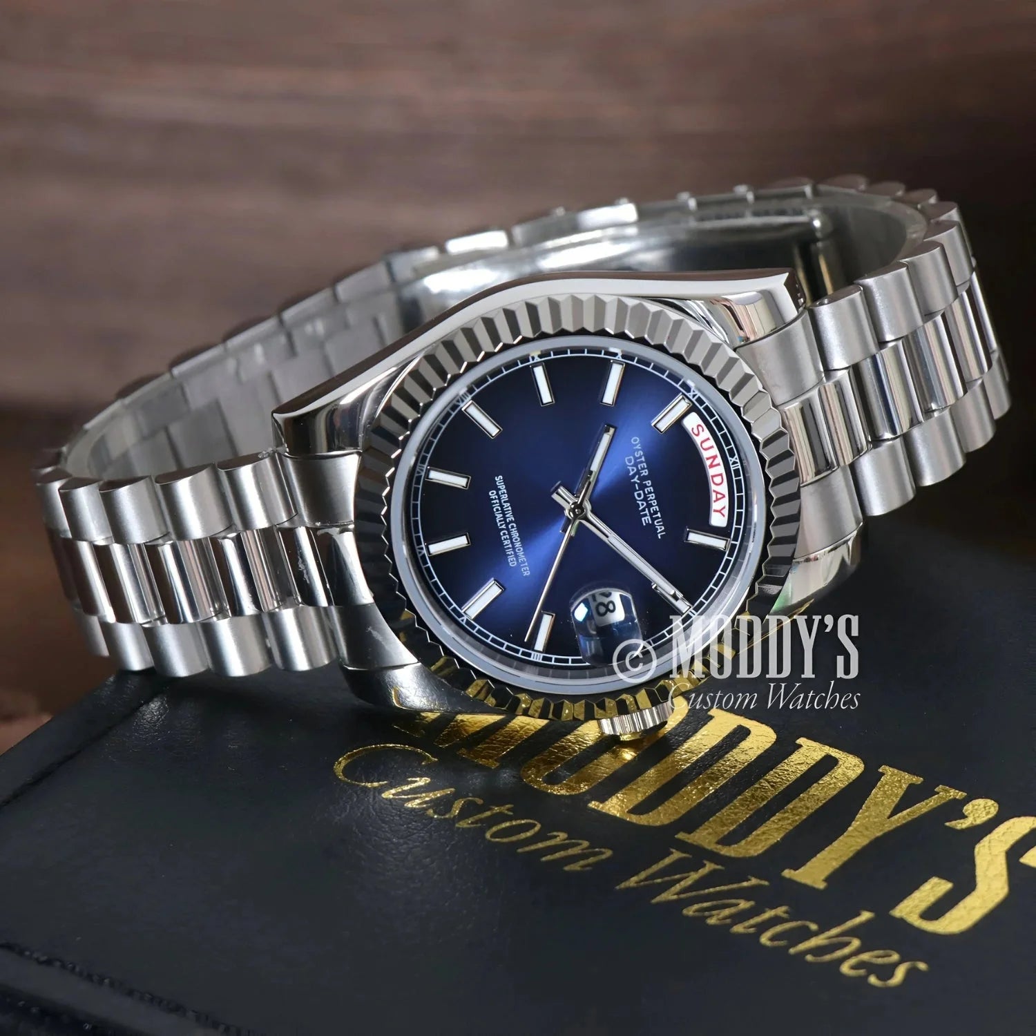Silver wristwatch with blue face from Seikojust Daydate Royal Blue in 904L stainless steel