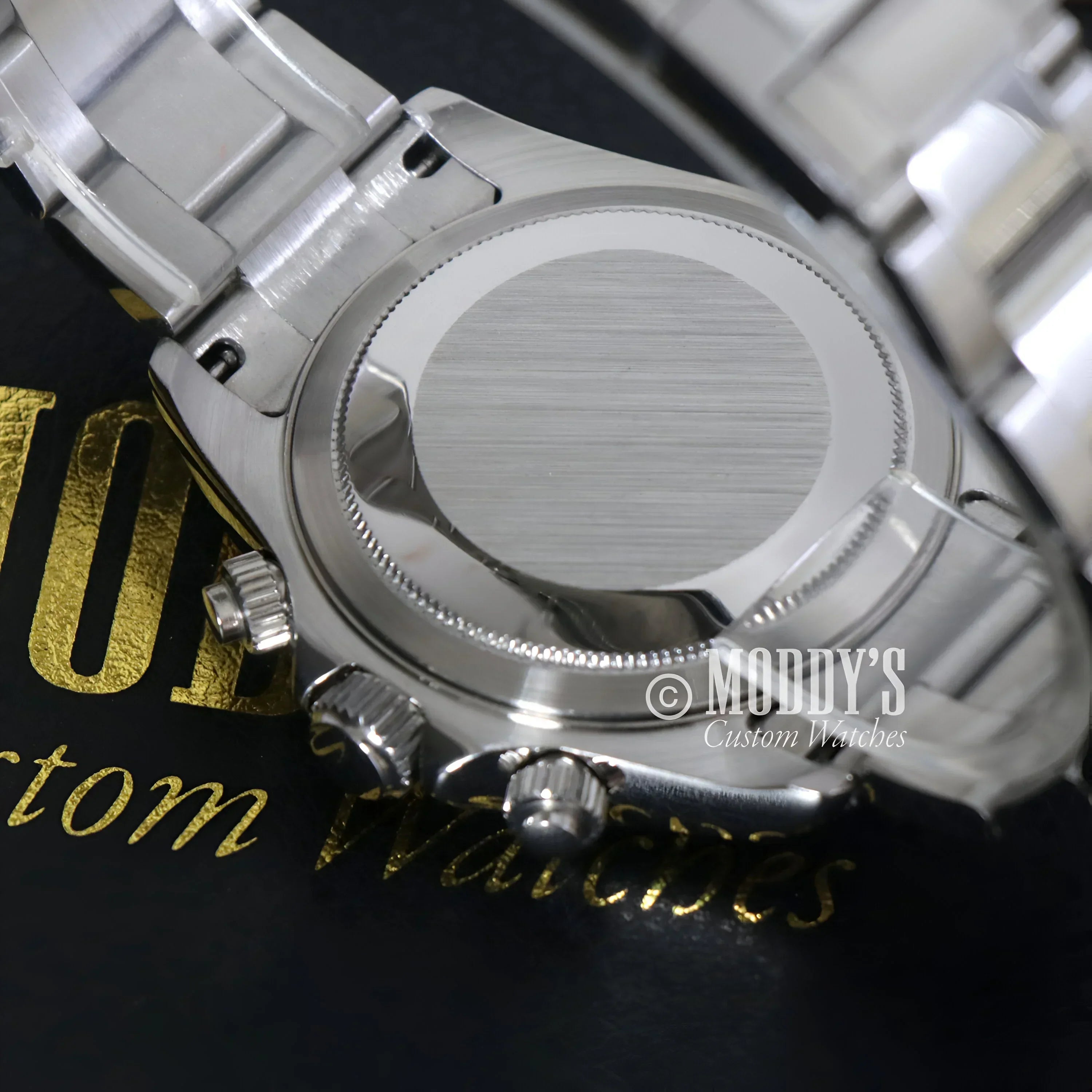 Silver wristwatch back showcasing Seiko VK63 hybrid movement in Seitona Arabic Black