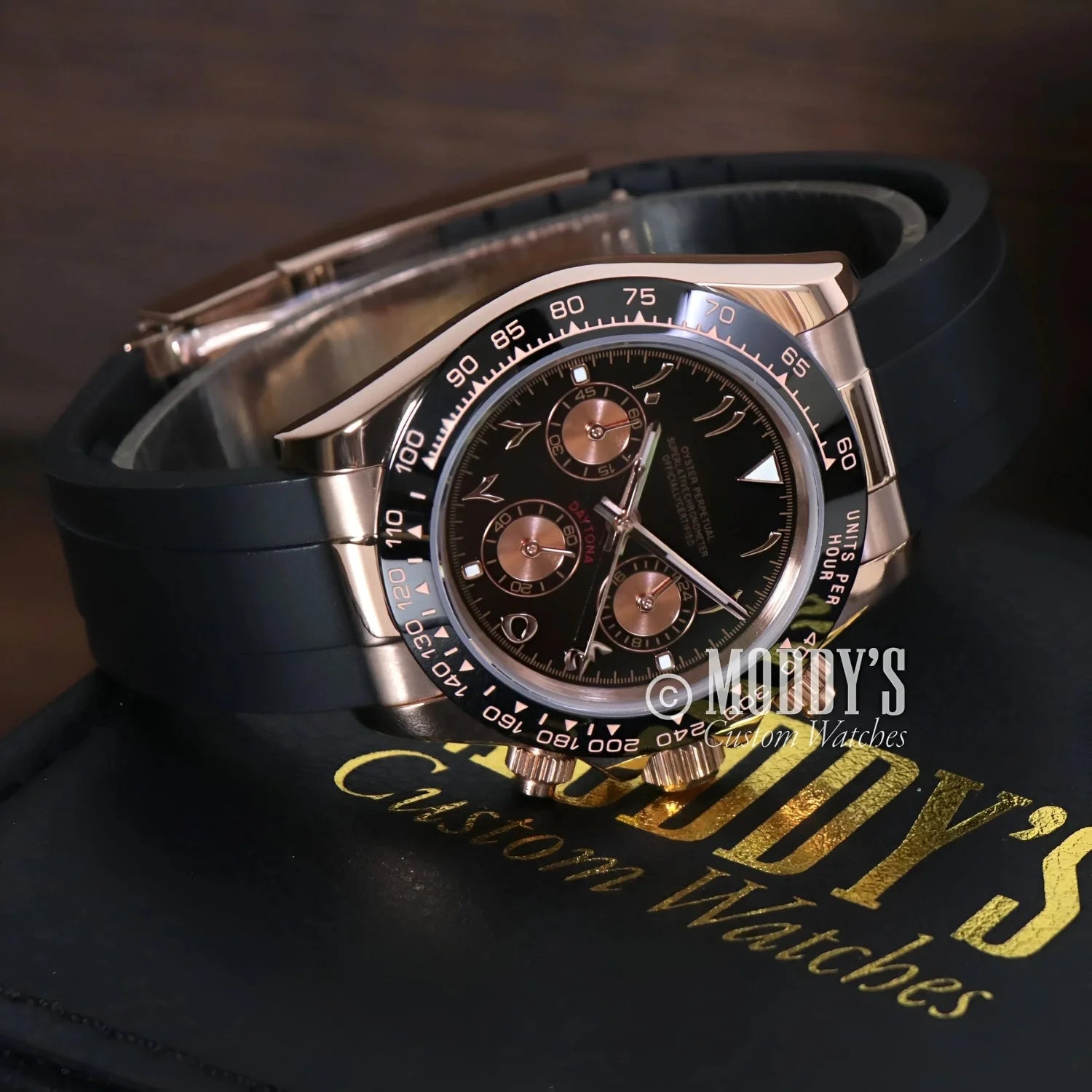 Rose gold chronograph wristwatch with black rubber strap featuring VK63 hybrid movement