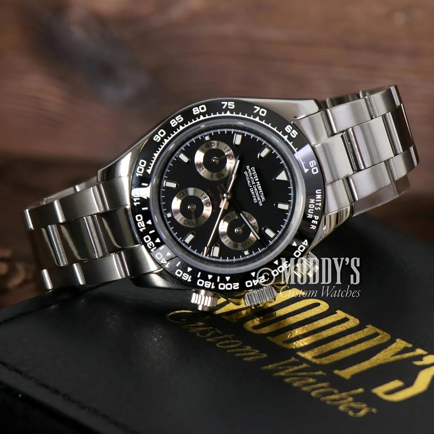 Silver wristwatch with black face from Seitona Black Panda featuring VK63 hybrid movement