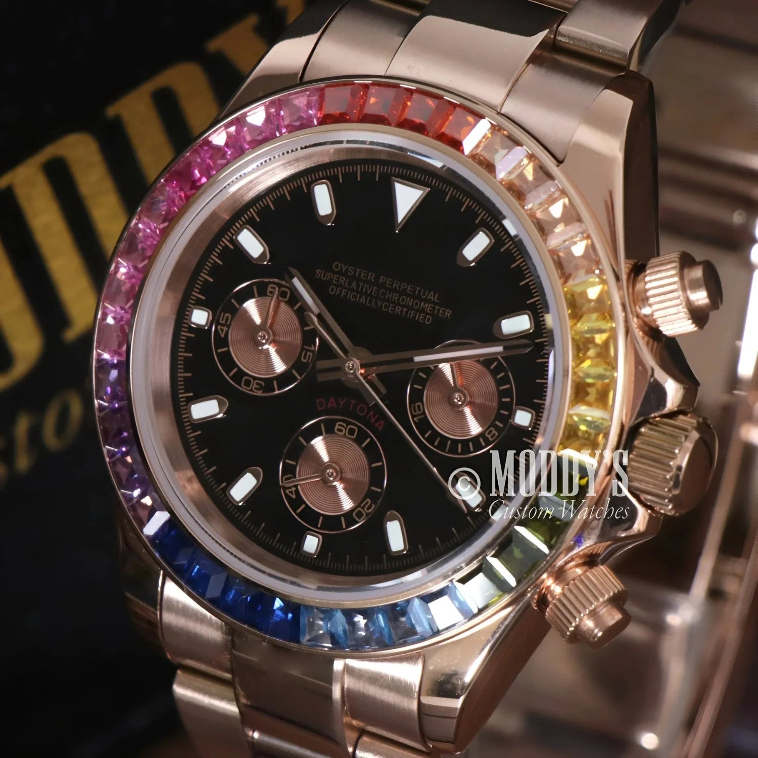 Rose gold watch with rainbow gemstone bezel featuring Seiko VK63 hybrid movement