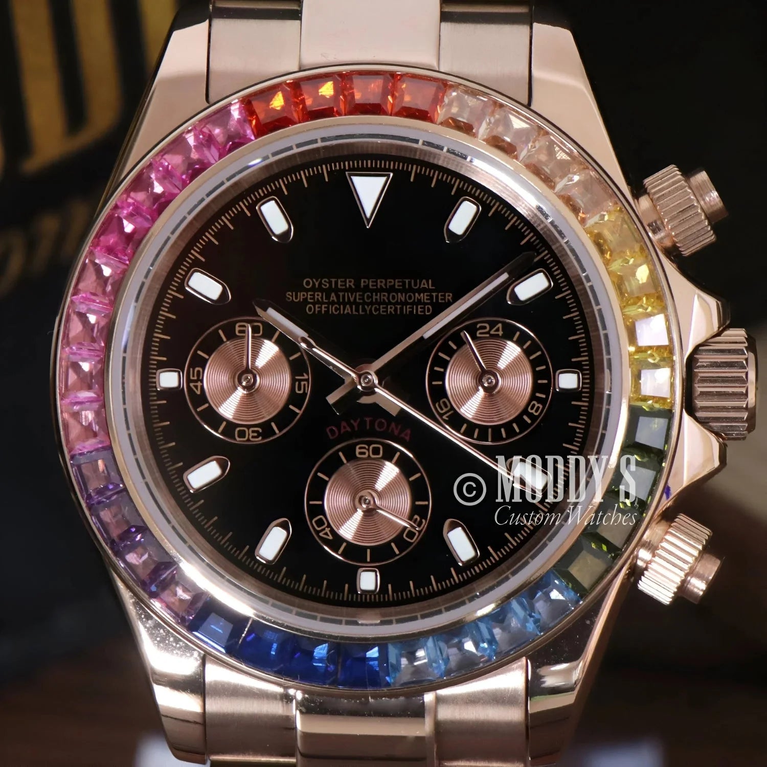 Rose Gold Daytona watch with rainbow sapphire bezel, featuring Seiko VK63 hybrid movement