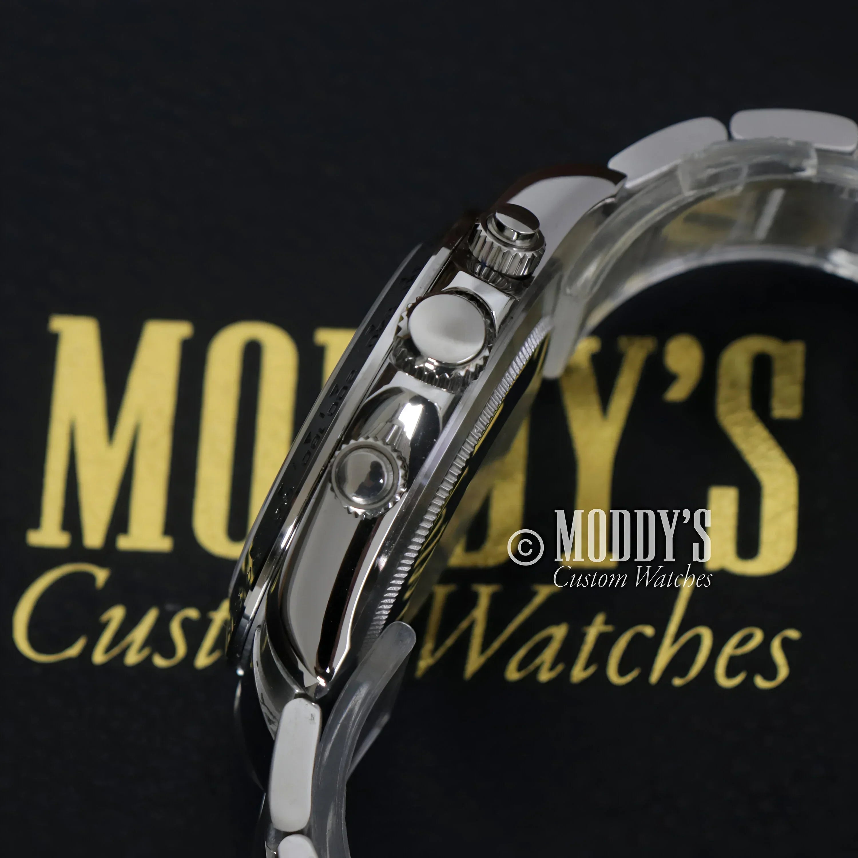 Silver wristwatch with chronograph pushers, featuring Seiko VK63 hybrid movement