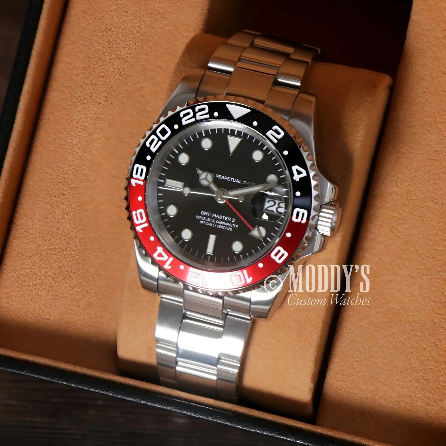Silver GMTeiko Coke wristwatch with red and black bezel, featuring NH34 automatic movement