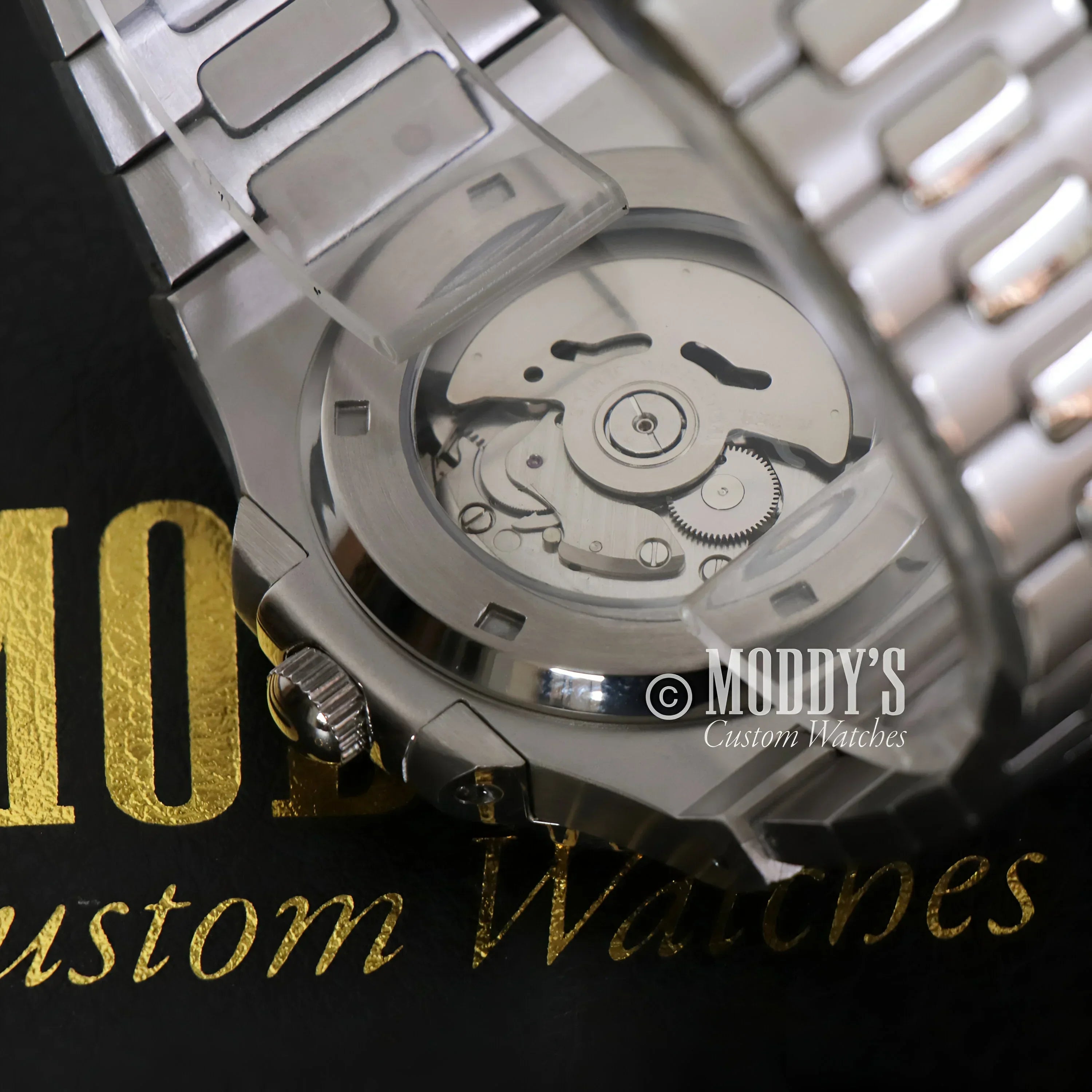 Silver Nautiko wristwatch showcasing Seiko NH35 automatic movement detail