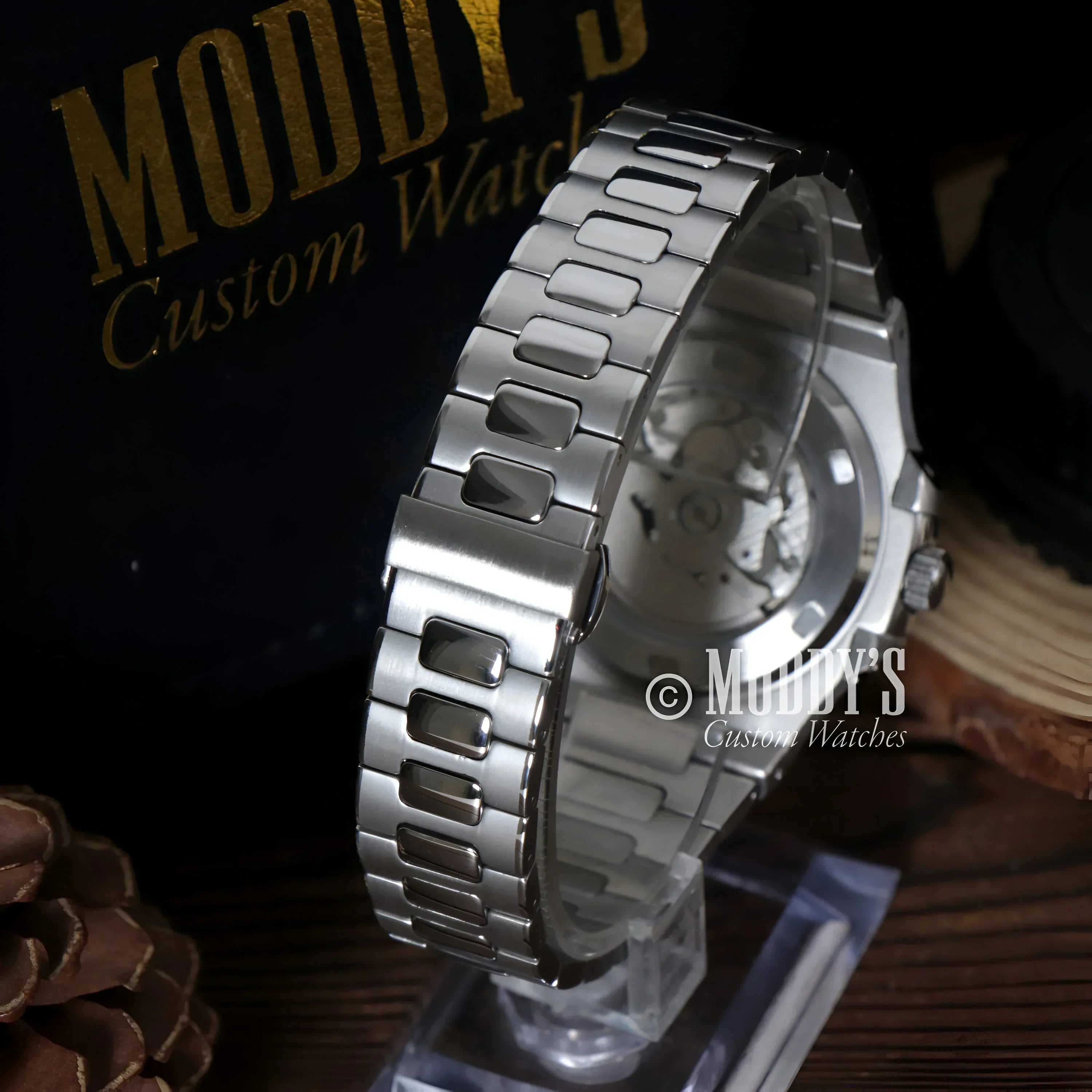 Silver wristwatch with metal band featuring NH35 automatic movement and 904L stainless steel