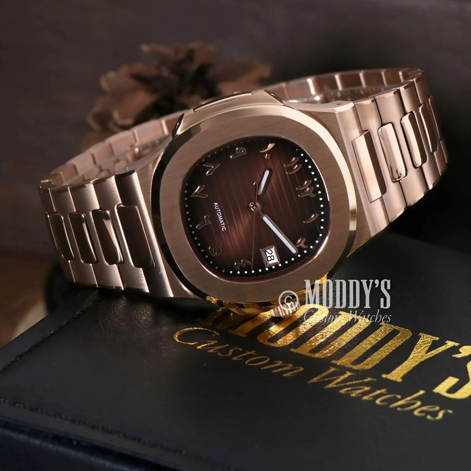Rose gold wristwatch with Arabic numerals and NH35 automatic movement by Nautiko