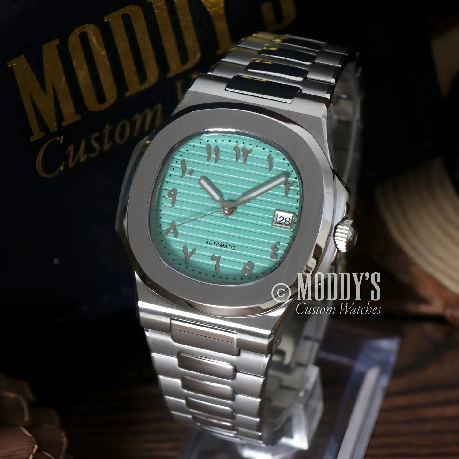 Silver Nautiko Arabic Tiffany Blue wristwatch with turquoise face and Seiko NH35 automatic