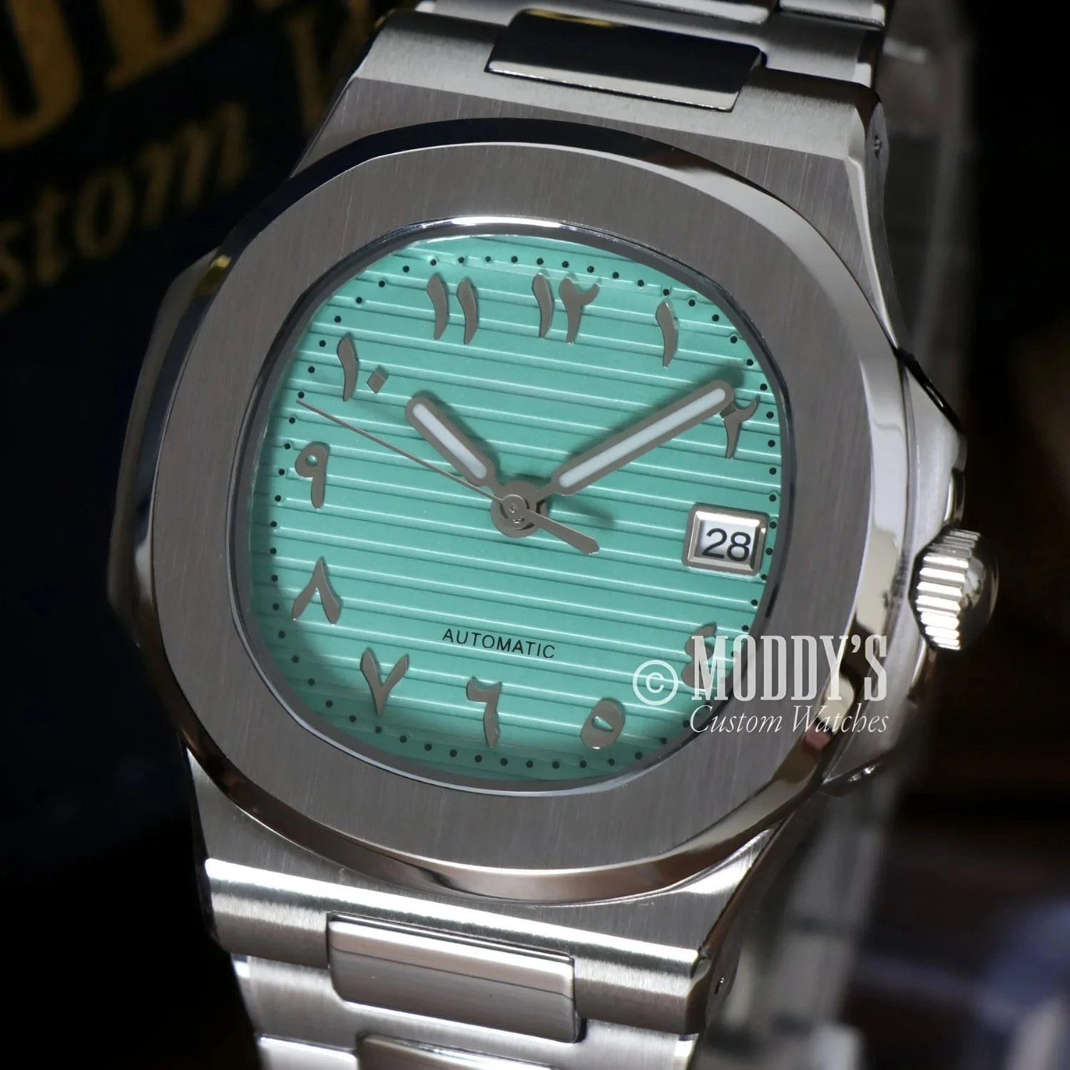 Silver wristwatch with Arabic numerals, Nautiko in Tiffany Blue with Seiko NH35 automatic movement