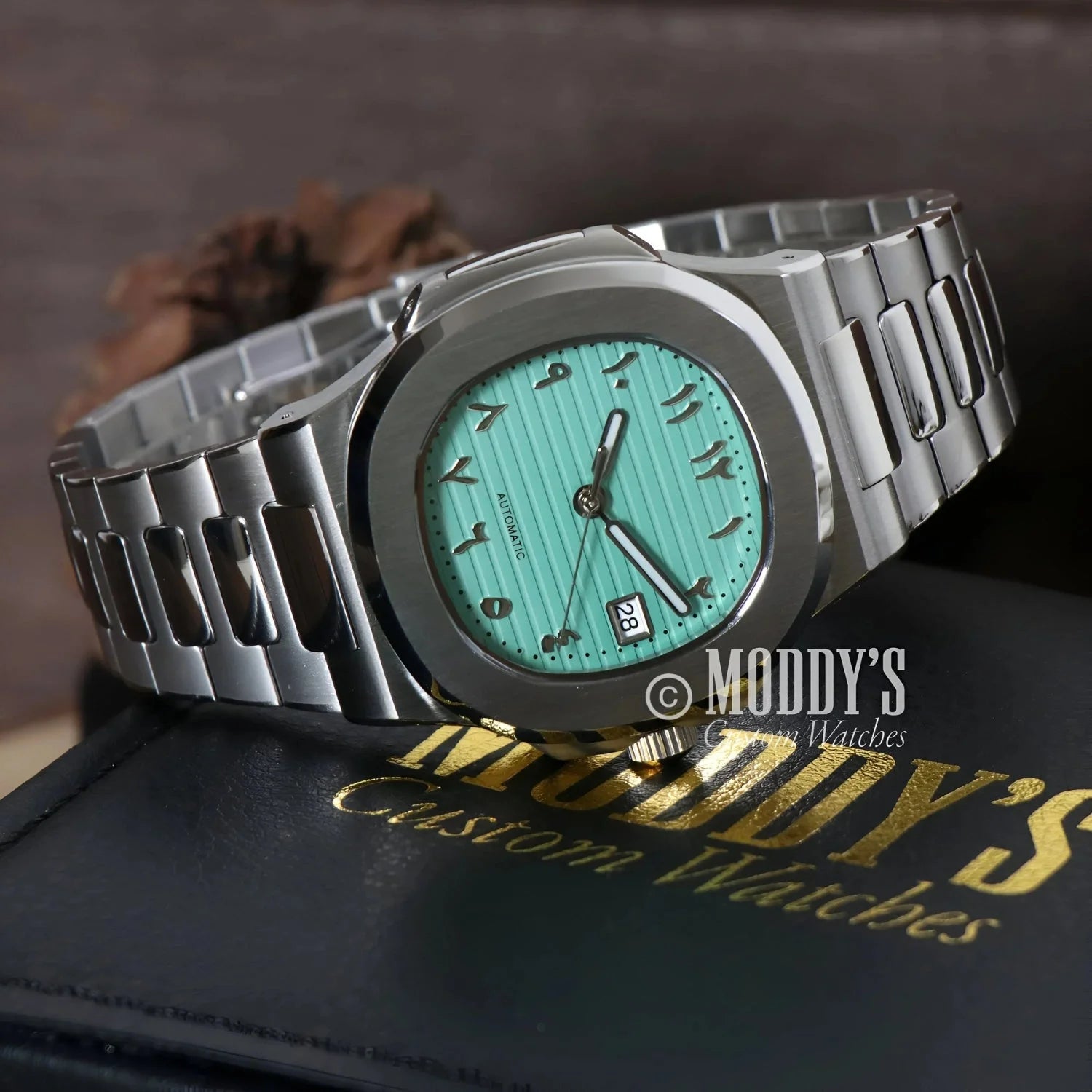 Silver Nautiko Arabic Tiffany Blue wristwatch with turquoise face and Seiko NH35 automatic
