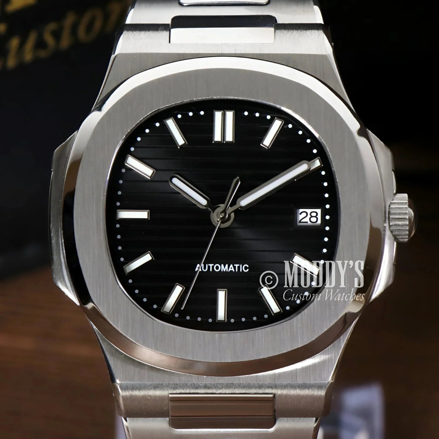 Silver Nautiko Black wristwatch featuring a black face with NH35 automatic movement