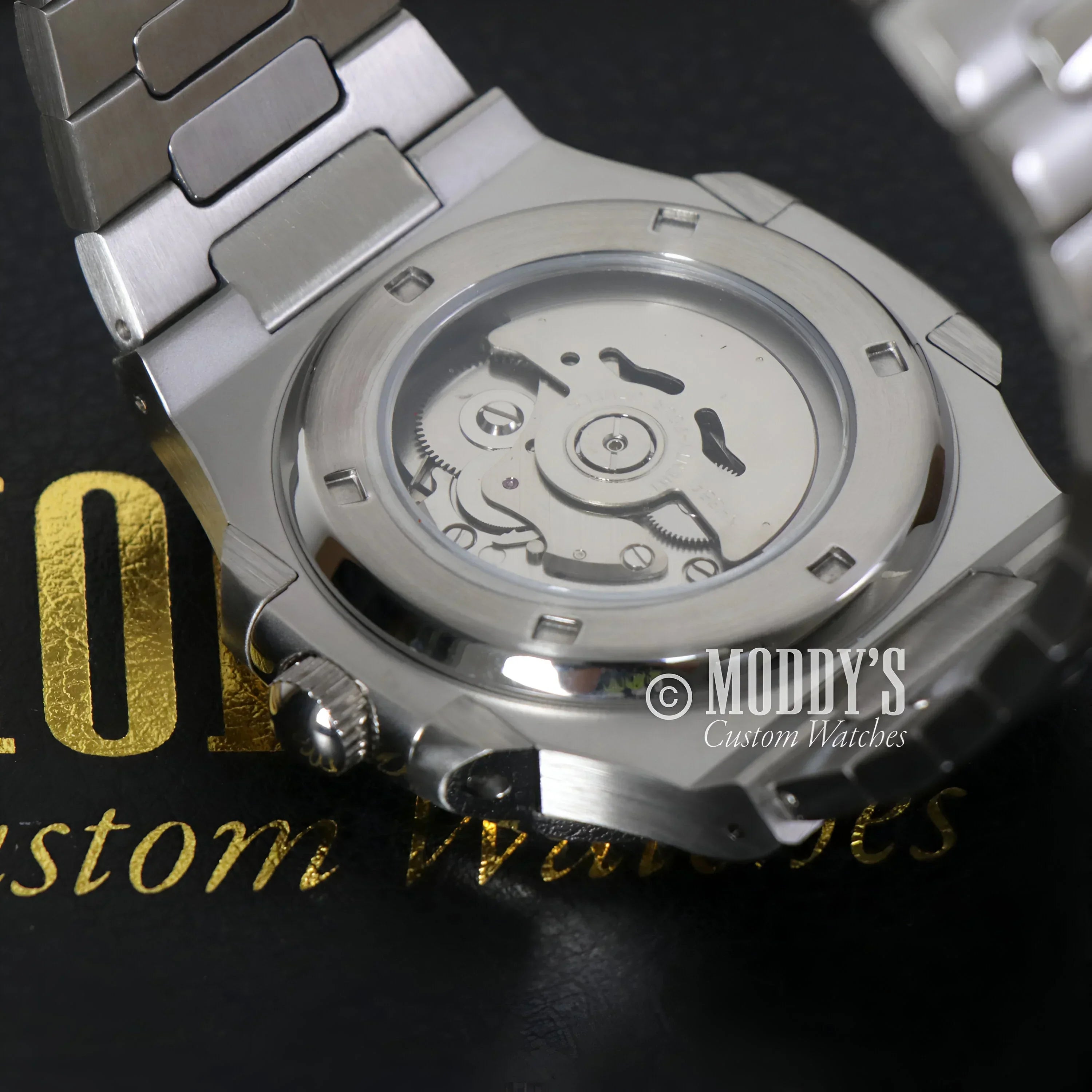 Silver Nautiko | Black wristwatch showcasing NH35 automatic movement and 904L stainless steel