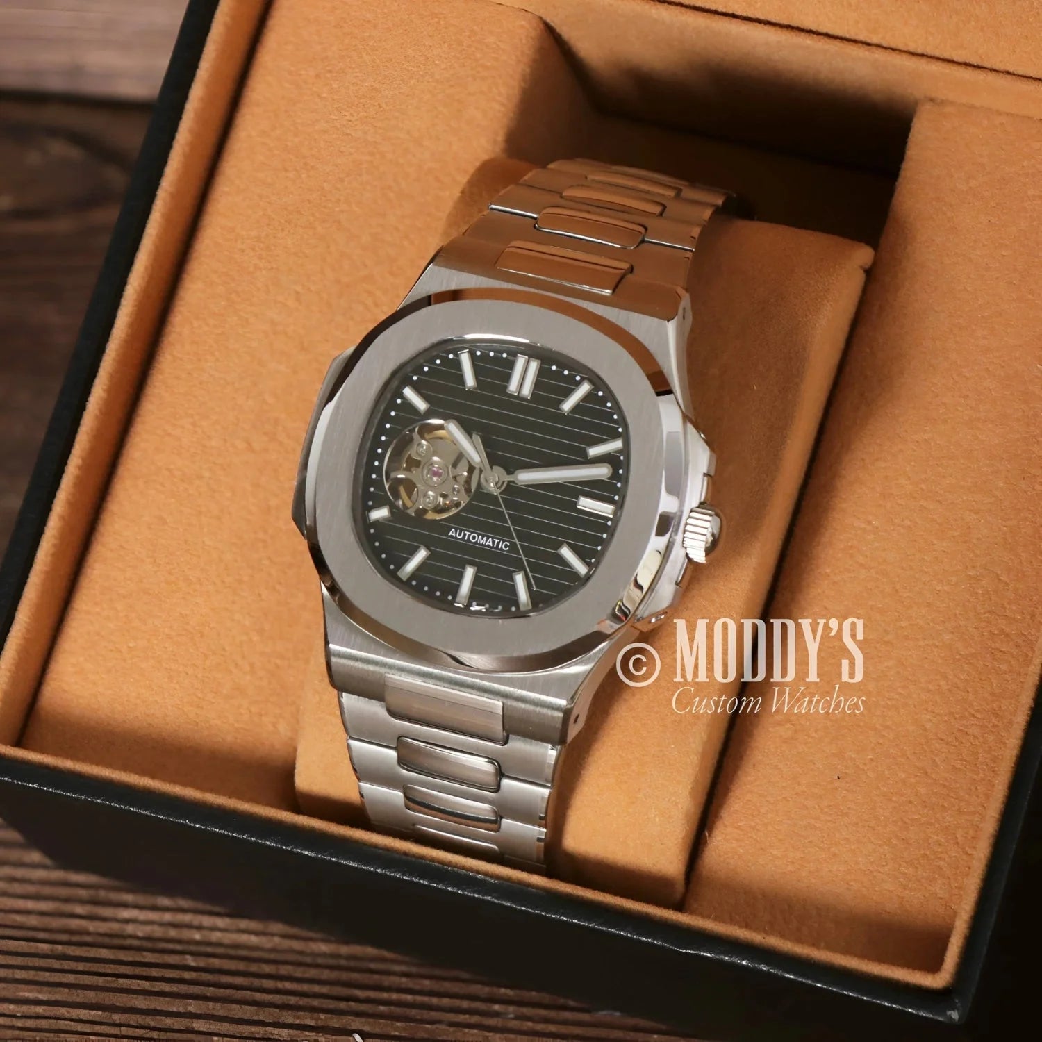 Silver automatic wristwatch featuring NH38 automatic movement and 904L stainless steel in Nautiko Black Open Movement