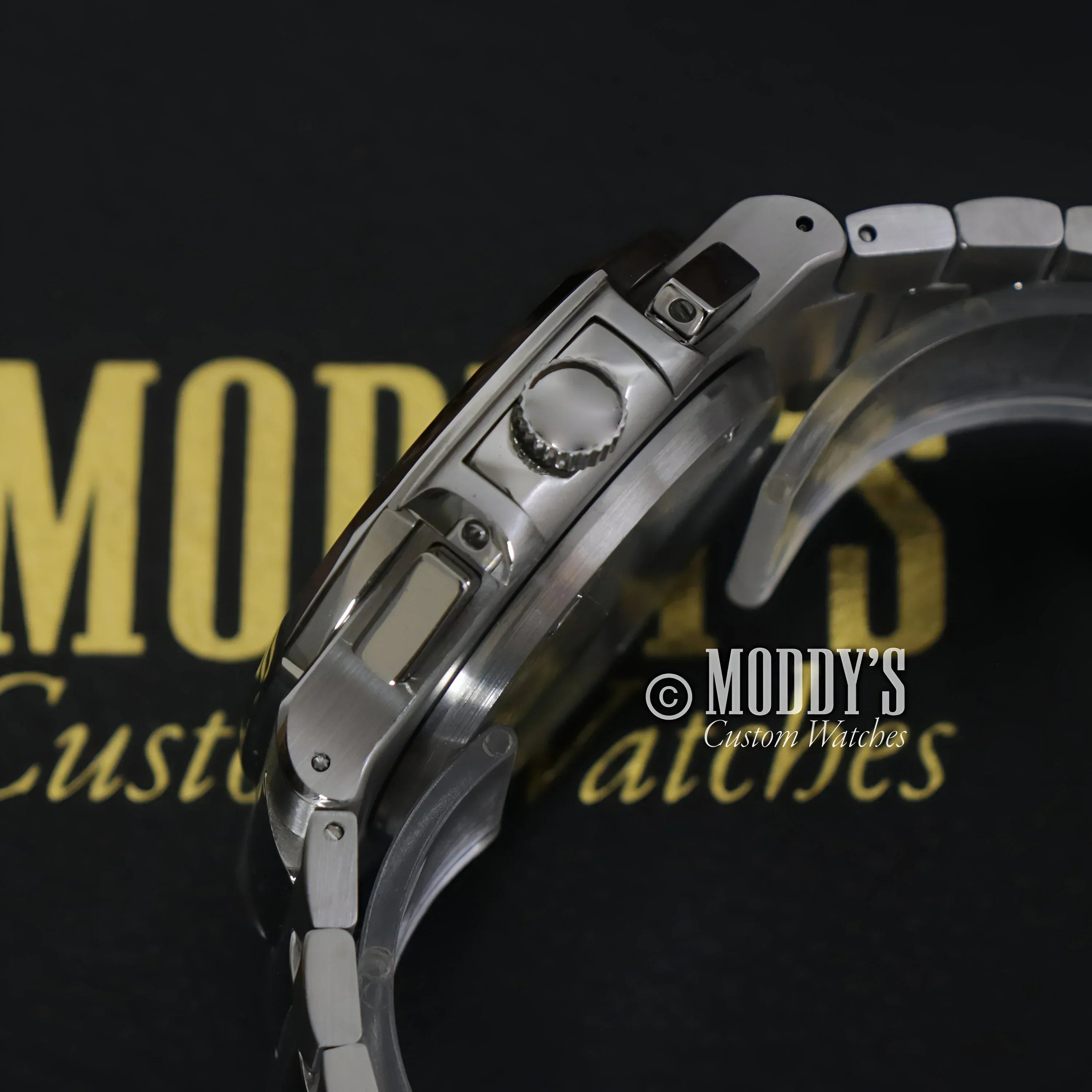 Silver Nautiko Chrono Black wristwatch with buttons, featuring Seiko VK61 hybrid movement