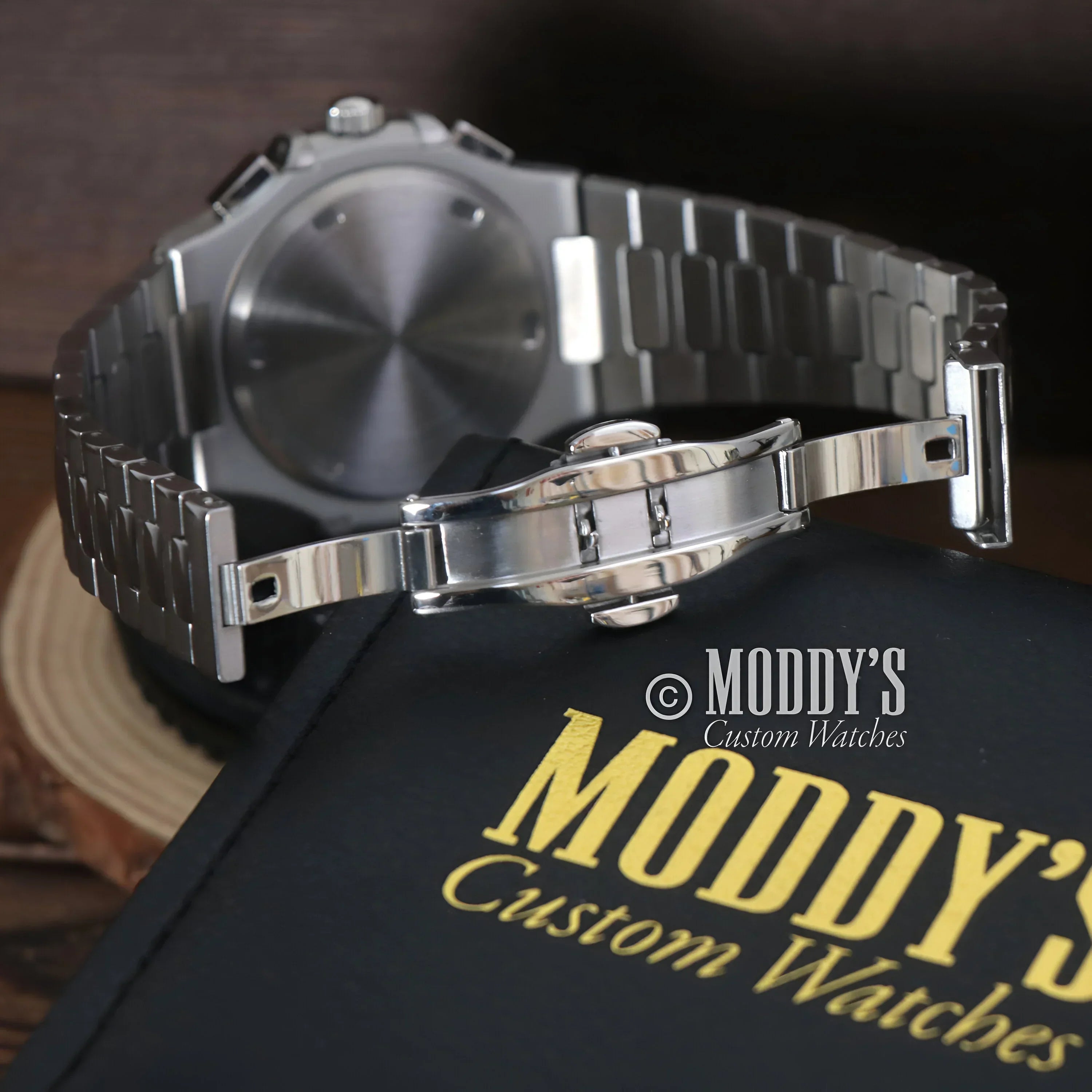 Silver metal watch with bracelet, Nautiko Chrono Black, featuring 904L stainless steel