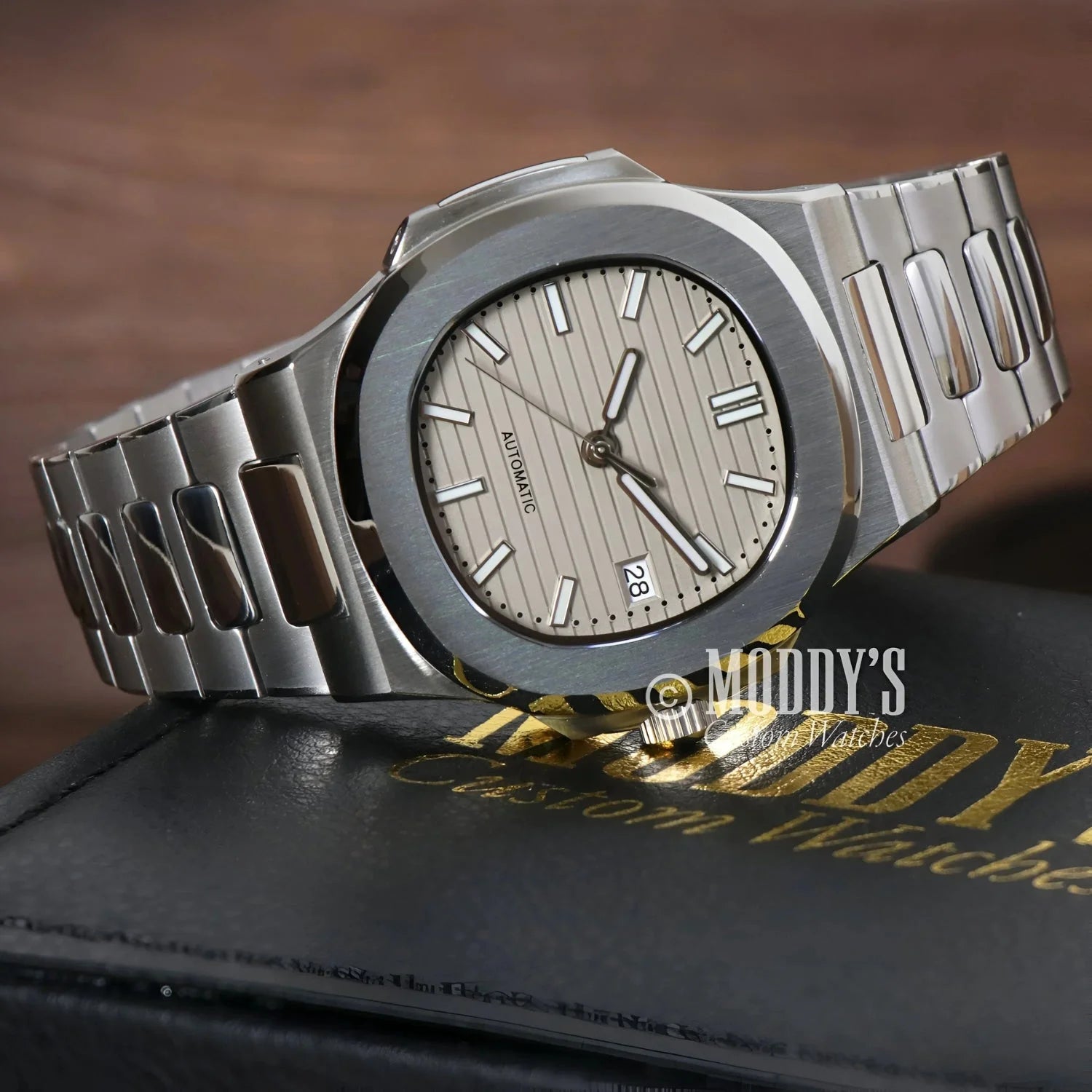 Silver Nautiko Cream wristwatch with striped face featuring NH35 automatic movement