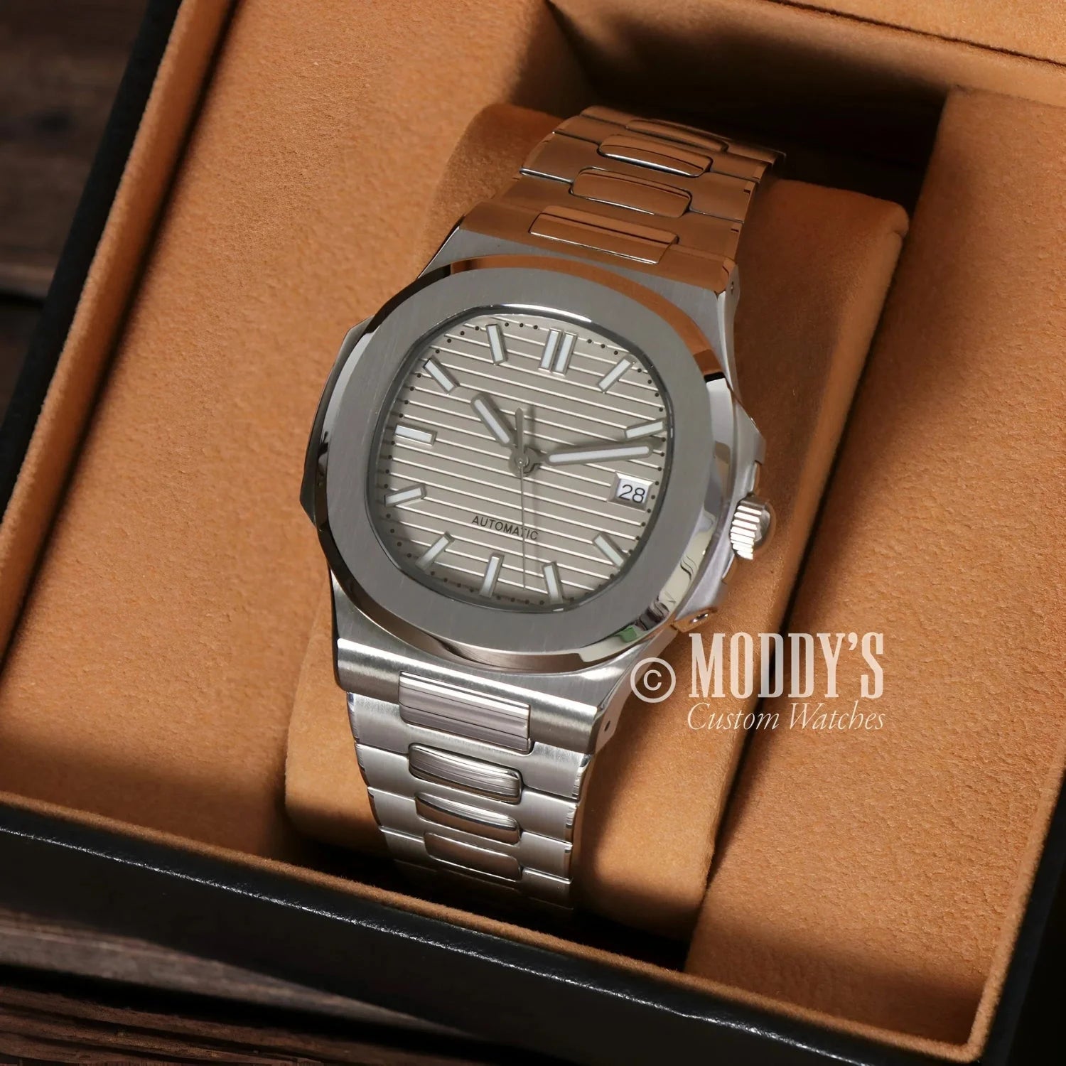 Silver wristwatch with metal band, featuring Seiko NH35 Automatic movement in Nautiko Cream