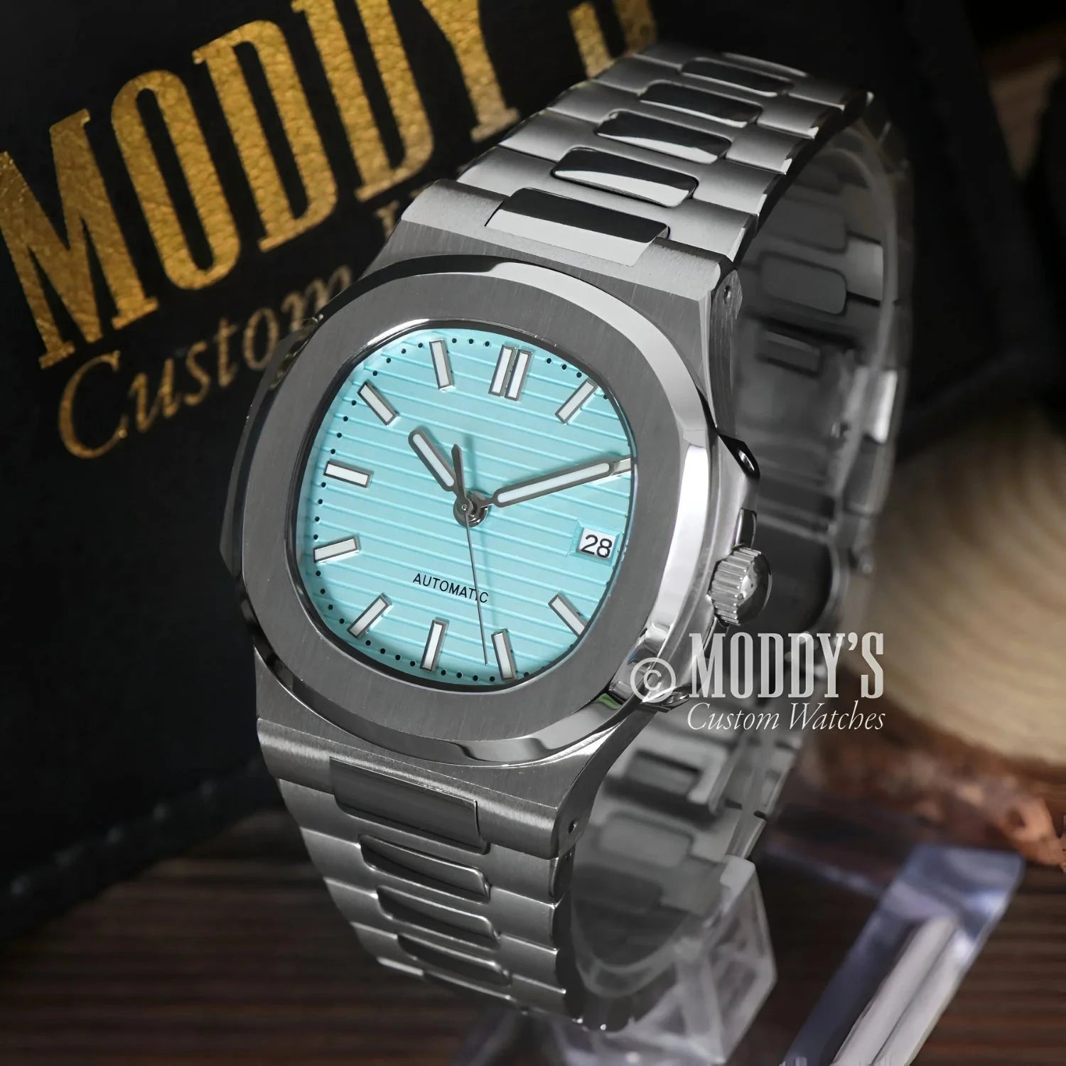 Silver wristwatch with a turquoise face, featuring NH35 automatic movement in Tiffany Blue