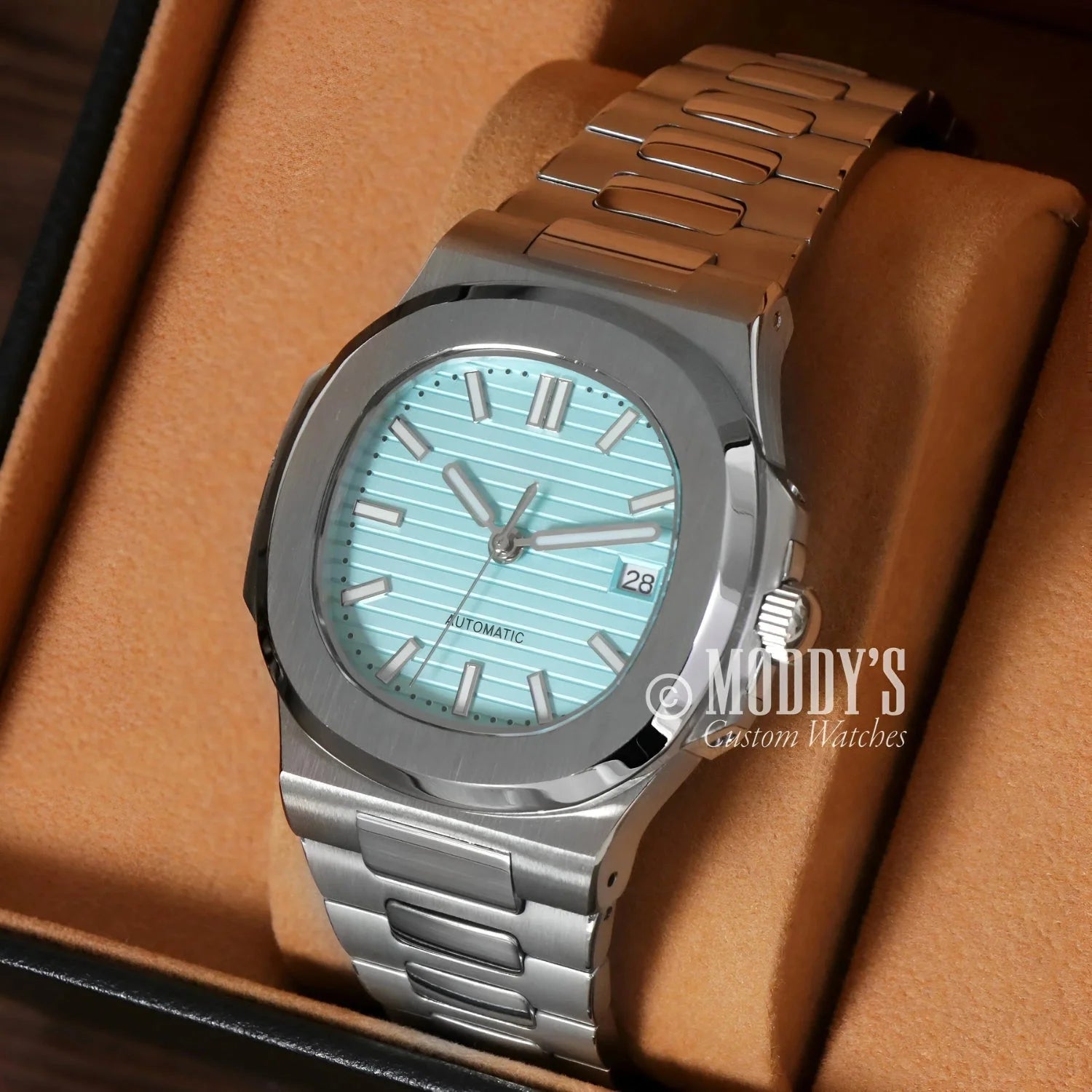 Silver wristwatch with light blue face, featuring NH35 automatic movement in Tiffany Blue