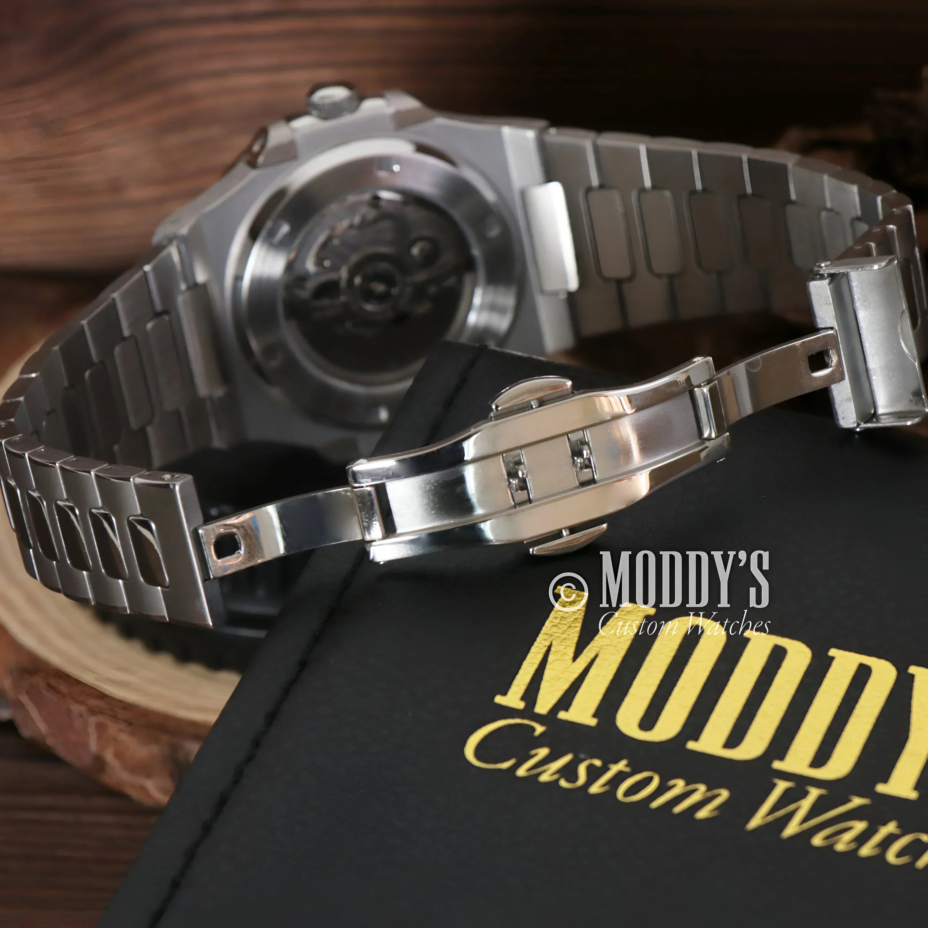 Silver wristwatch with exposed NH35 automatic movement in Tiffany Blue Nautiko design