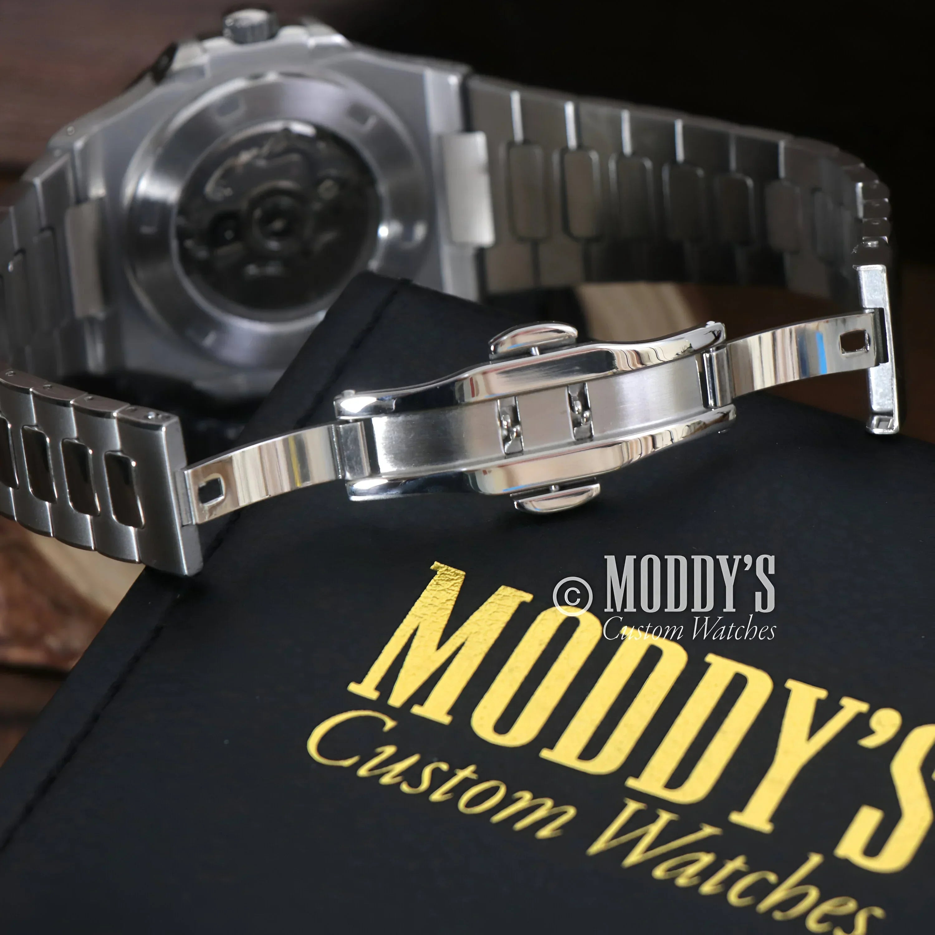 Silver wristwatch with deployment clasp from Nautiko, featuring a White Open Heart design