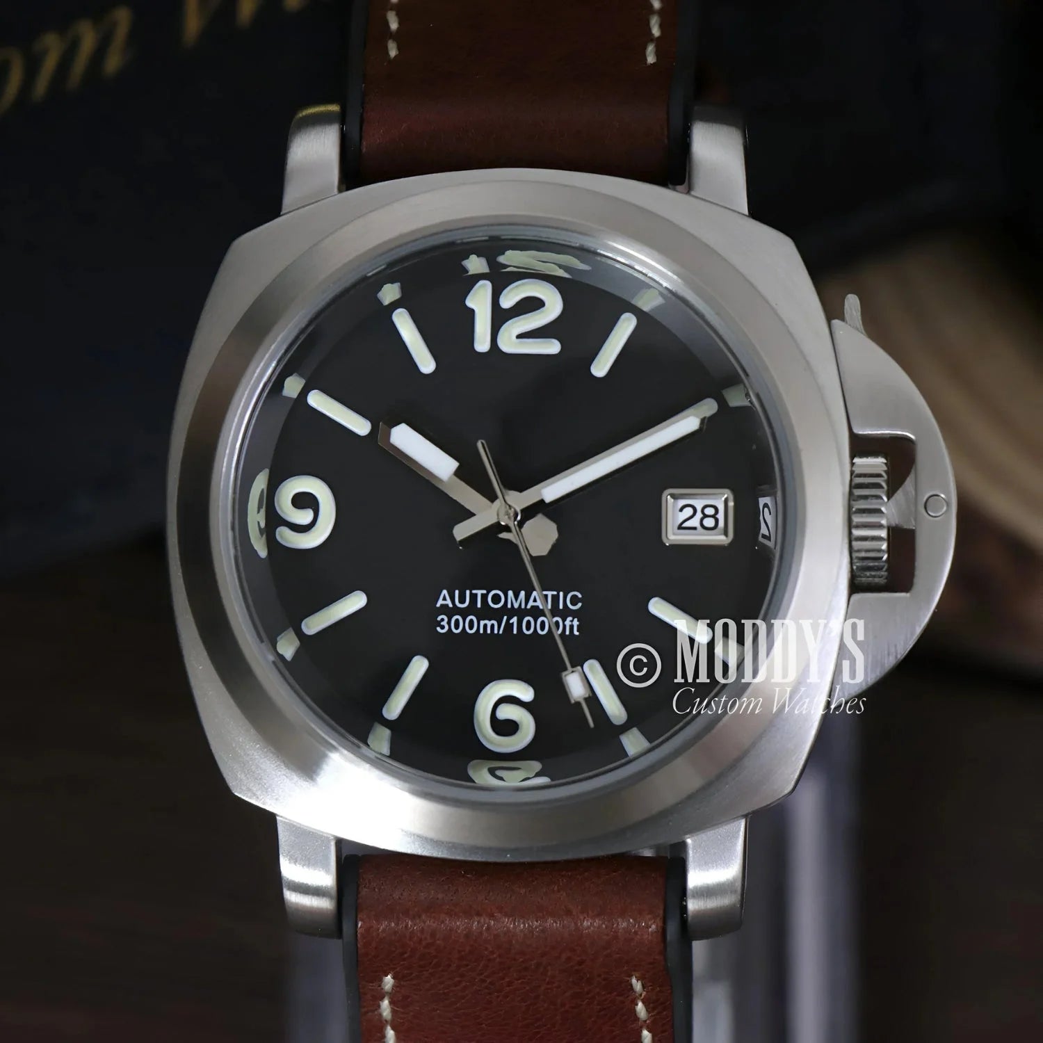 Silver-cased Paneiko wristwatch with brown leather band featuring NH35 automatic movement