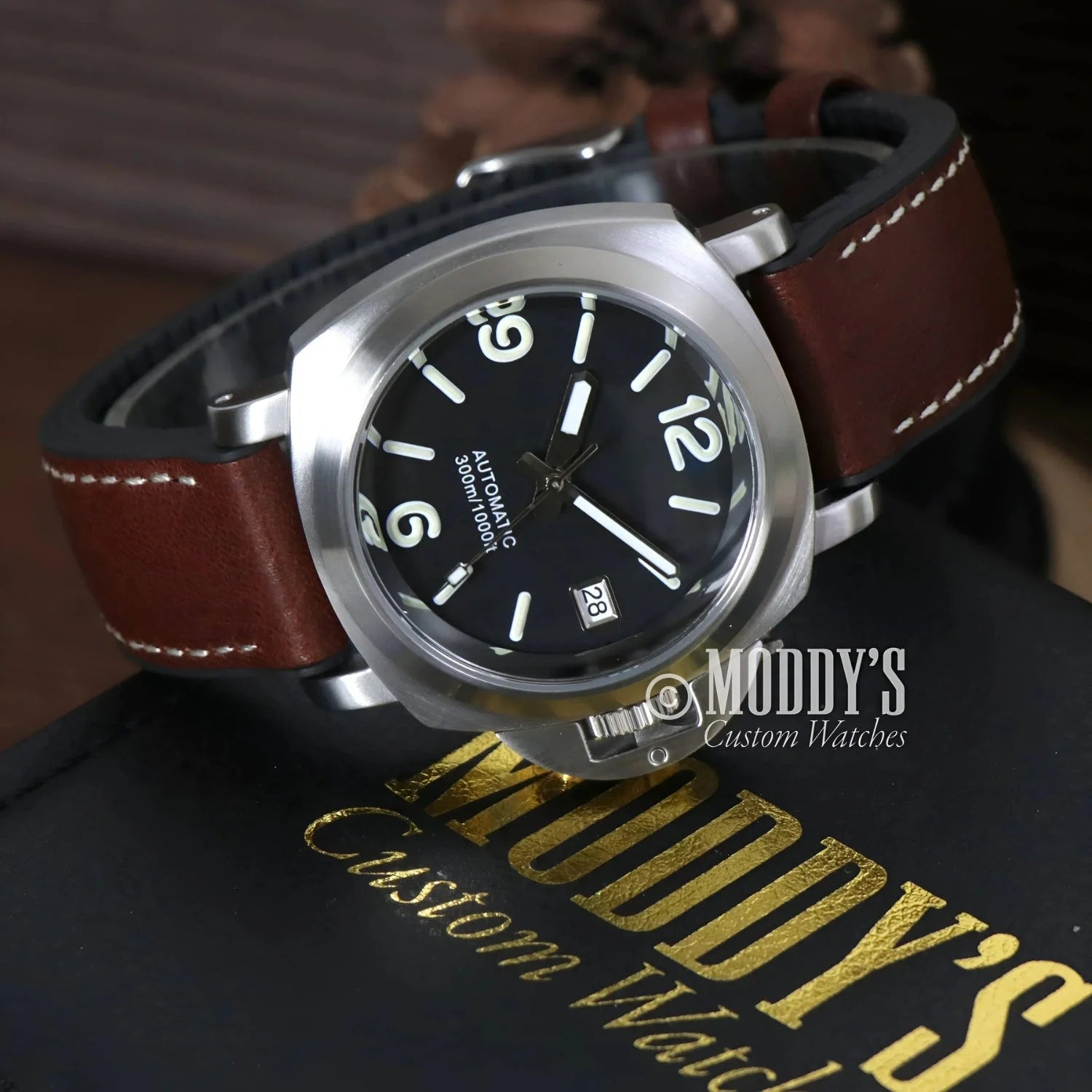 Silver-cased wristwatch with brown leather strap featuring NH35 automatic movement