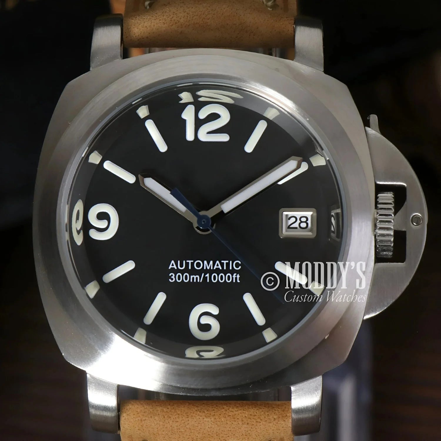 Silver wristwatch with black face featuring Seiko NH35 automatic movement, iconic Luminor design