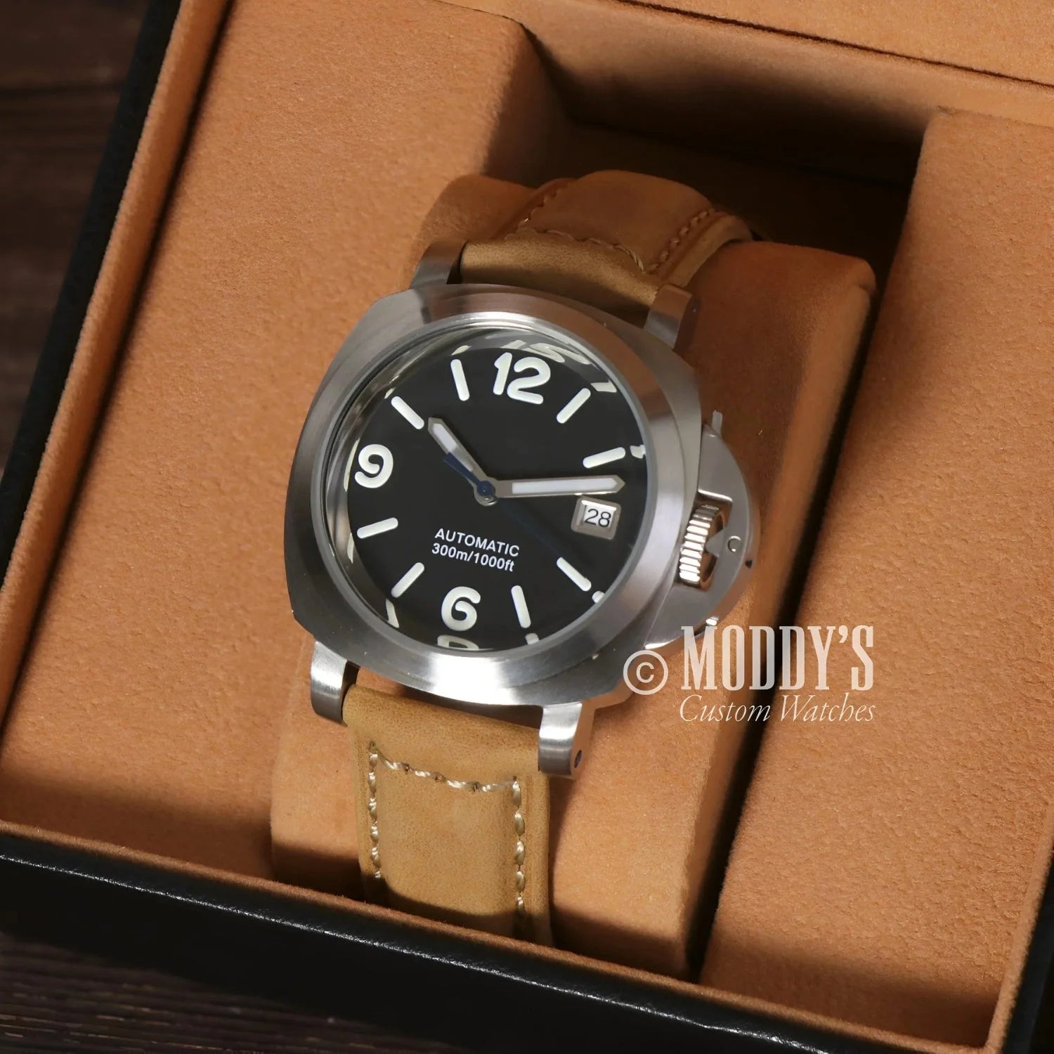 Silver watch with tan leather strap featuring Seiko NH35 automatic movement