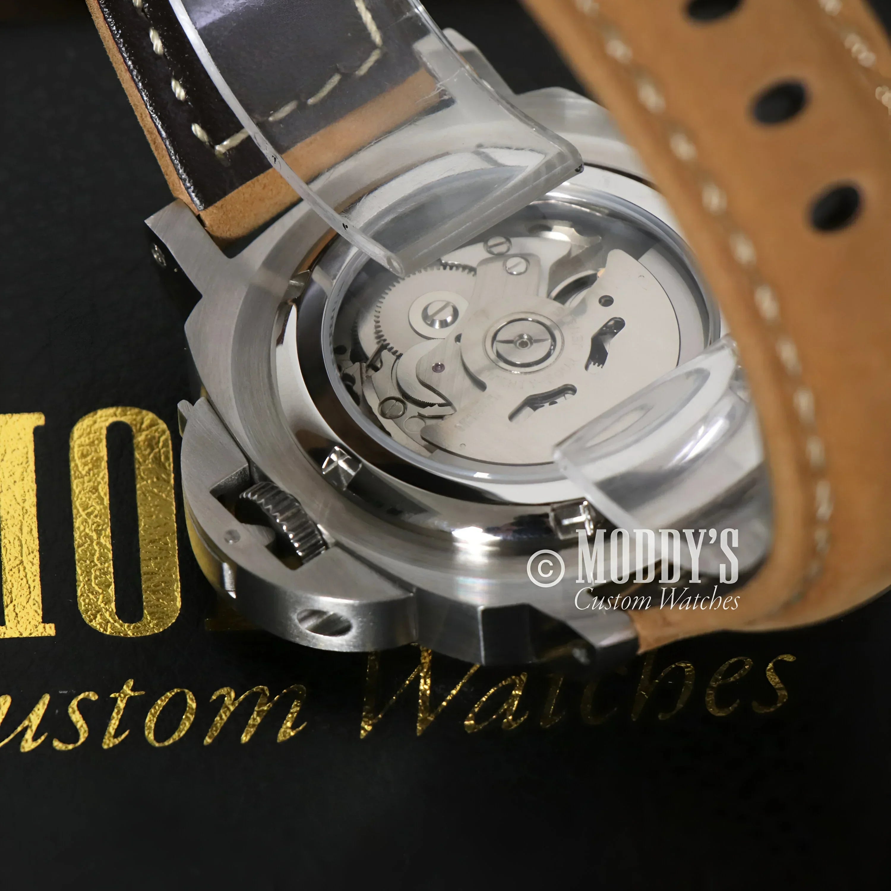 Exposed Seiko NH35 automatic movement in Paneiko Sand Leather watch showcasing iconic design