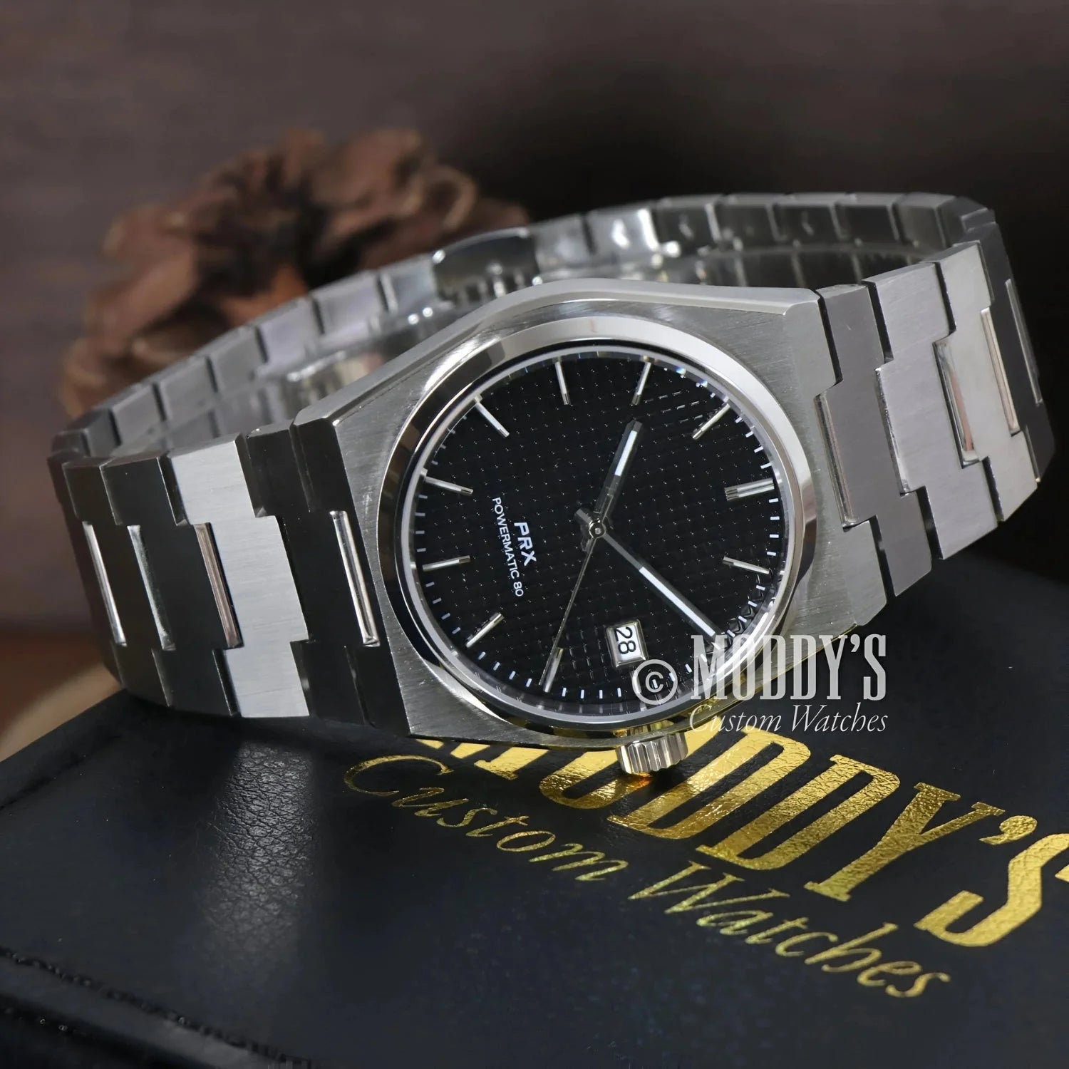 Silver wristwatch with black face featuring Seiko NH35 automatic movement PRXeiko Black