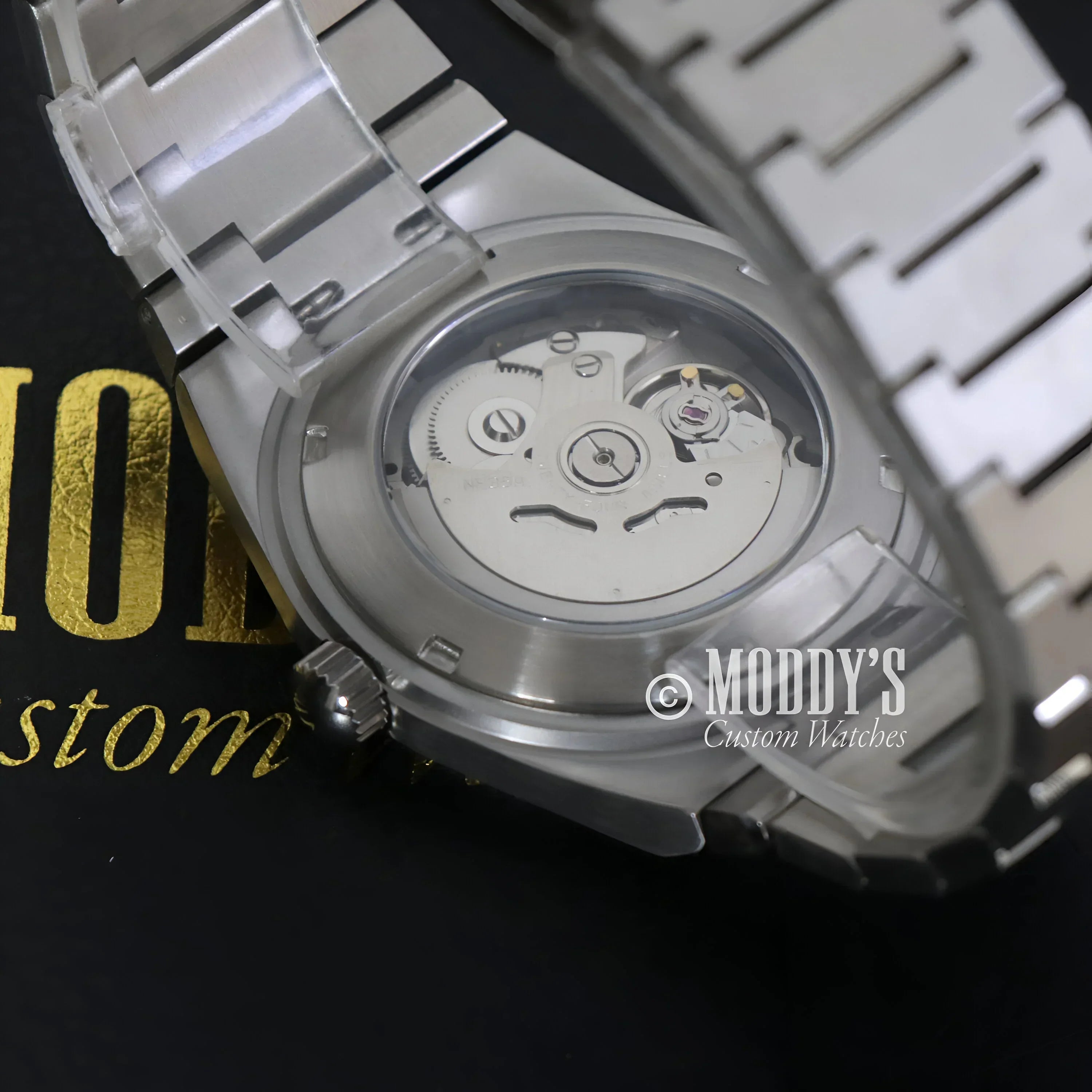 Silver wristwatch featuring NH35 automatic movement in the PRXeiko Black model