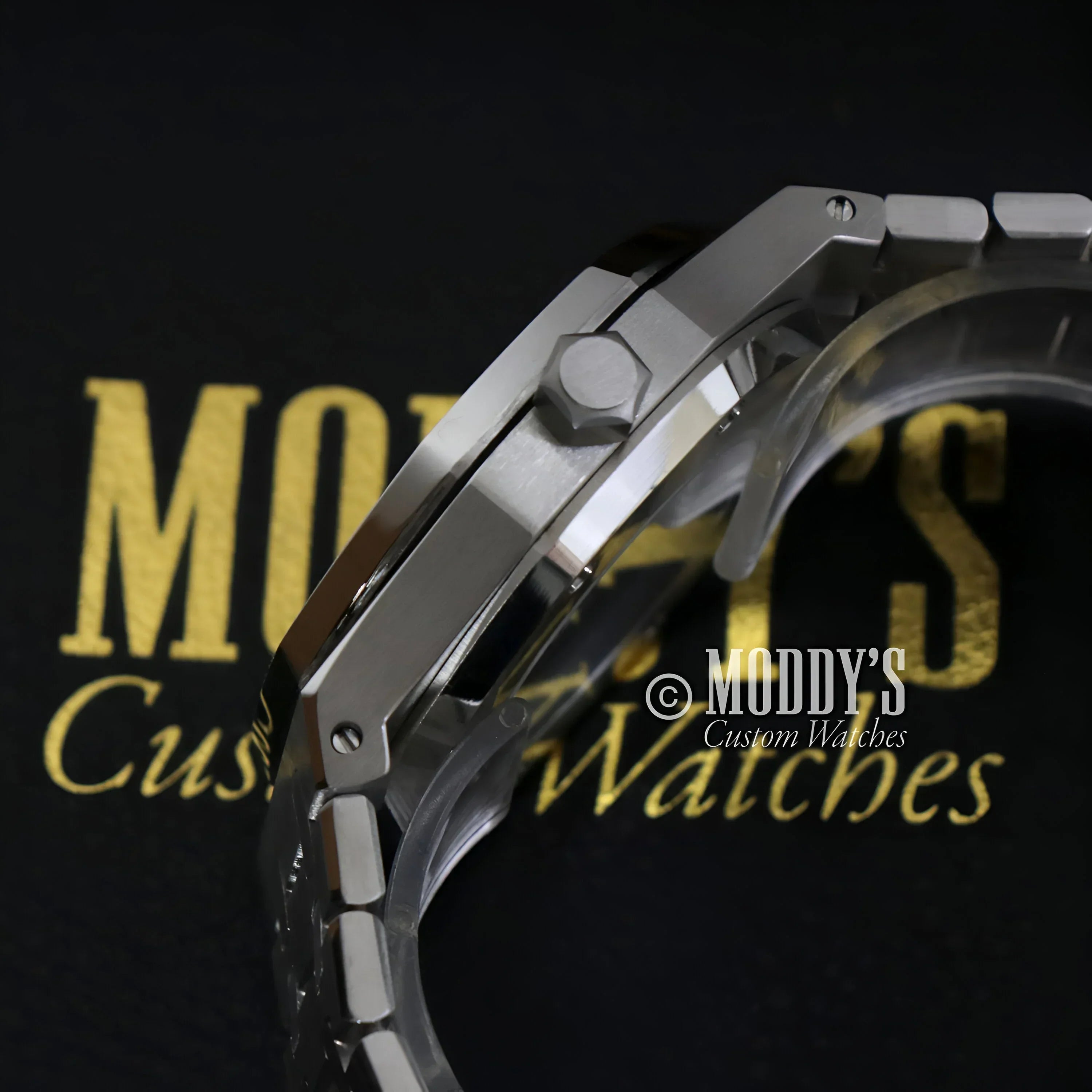 Silver wristwatch with metal band featuring NH35 automatic movement by Seiko Mod Royal