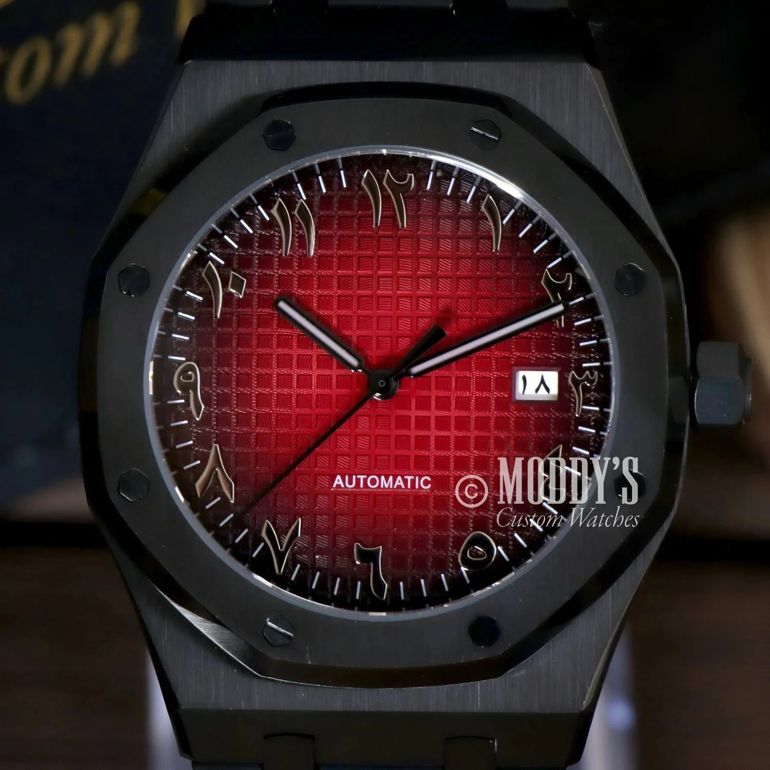 Black wristwatch with red face from Royal Seikoak featuring NH35 automatic movement