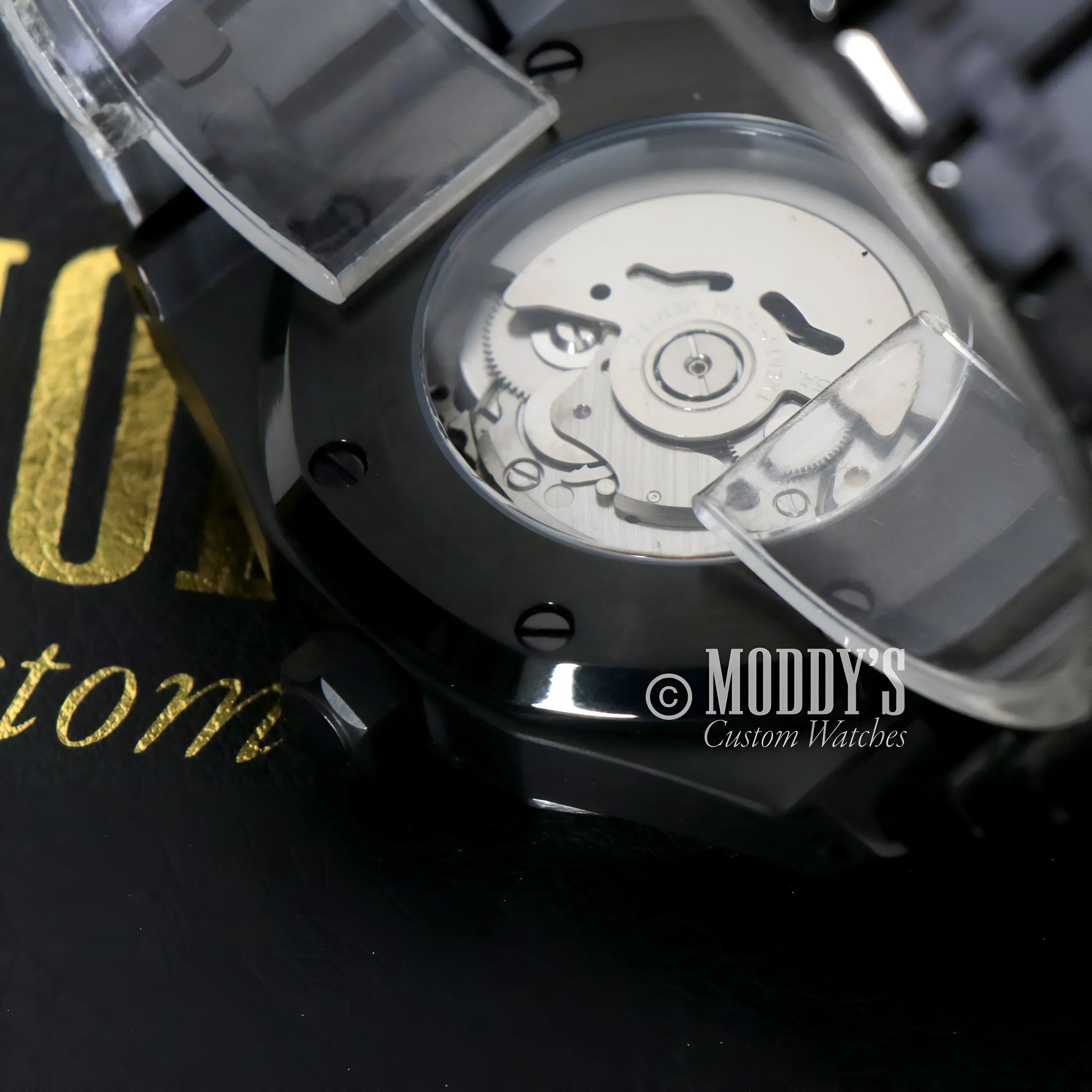 Black wristwatch with visible NH35 automatic movement, Royal Seikoak Arabic Black - Red